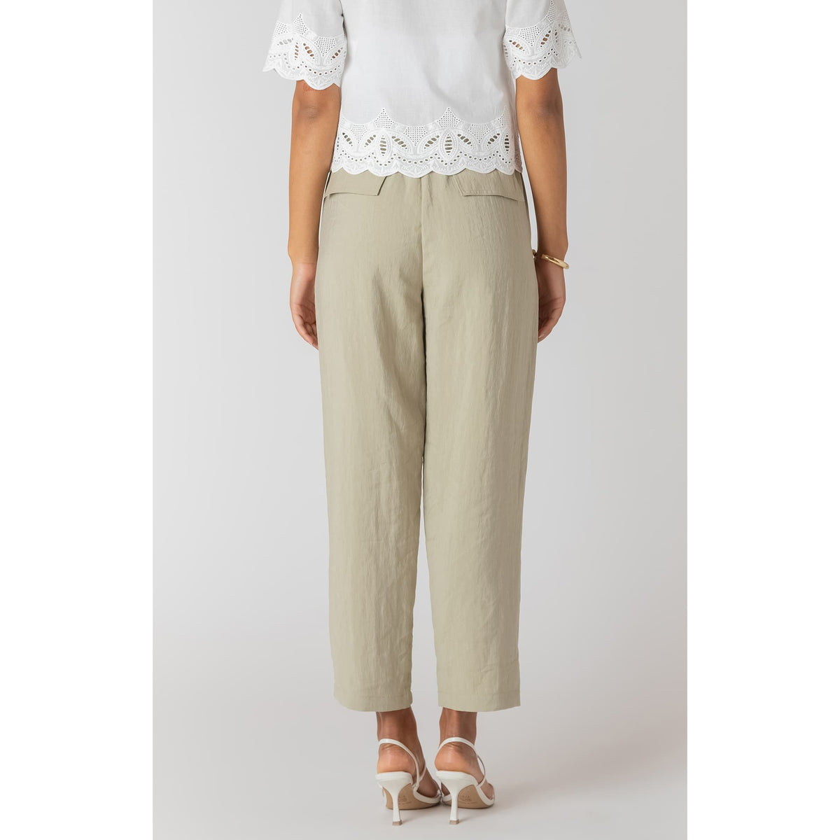 Room 34 straight leg casual pants in light beige with elastic waist and adjustable drawstring, cropped relaxed fit.