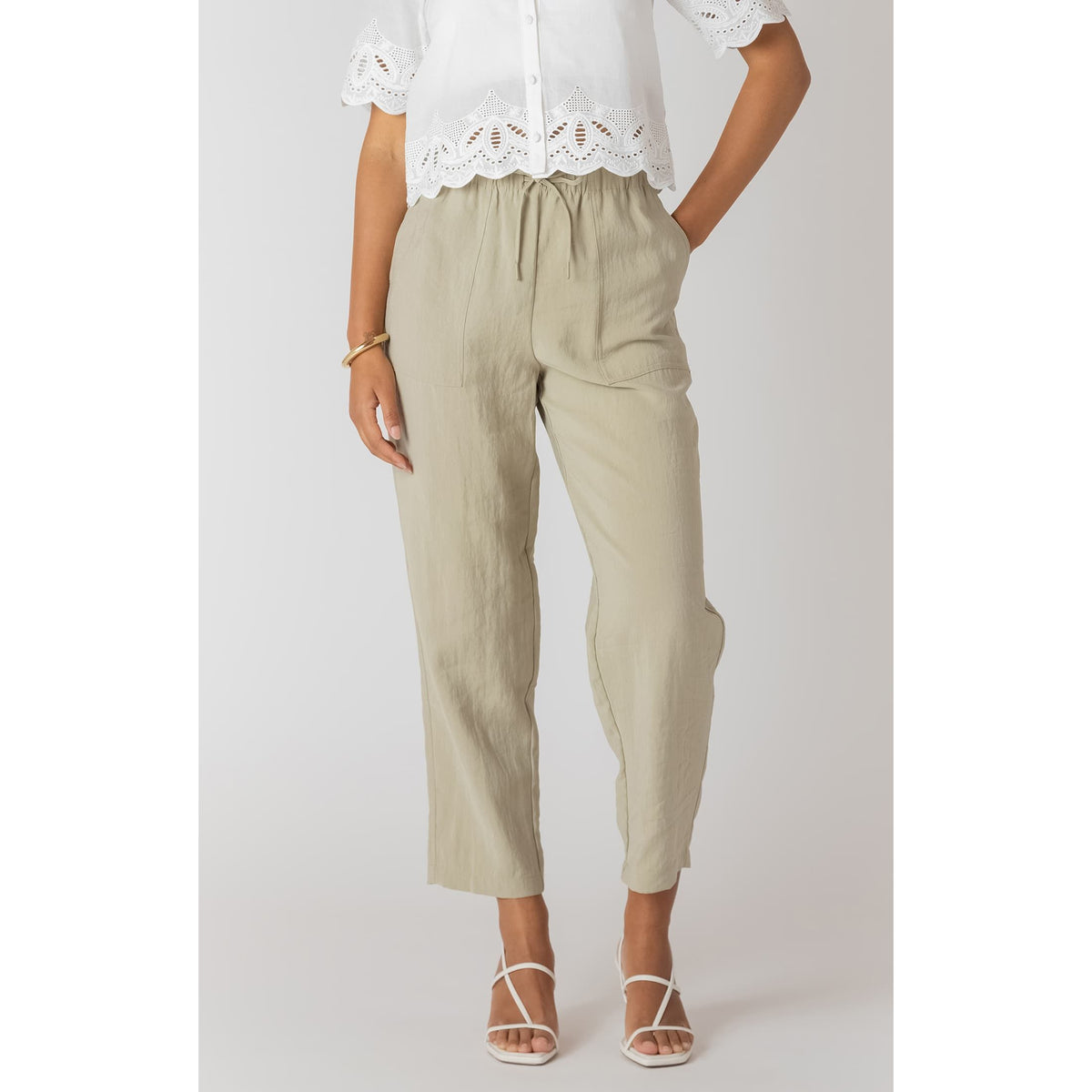Room 34 lightweight beige straight-leg pants with elastic drawstring waist and cropped relaxed fit.