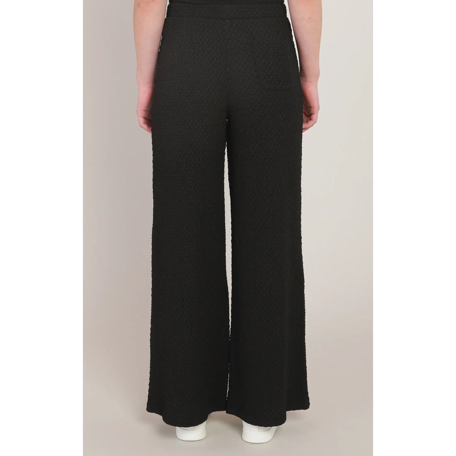 Black textured wide leg pants with a mid-rise fit and rear pocket, offering chic style and all-day comfort.