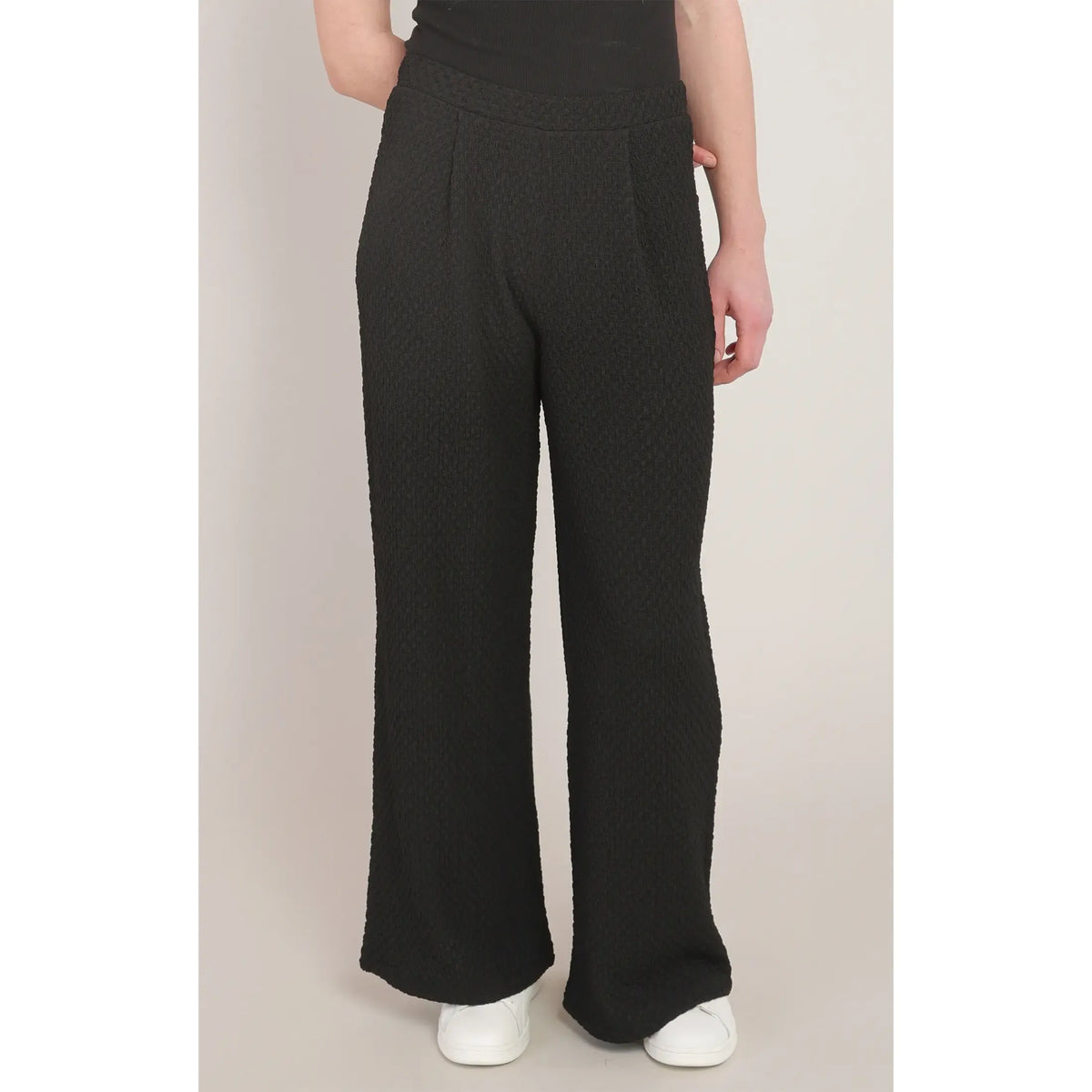 Black textured wide leg pants with a mid-rise fit and relaxed silhouette, offering chic style and all-day comfort.