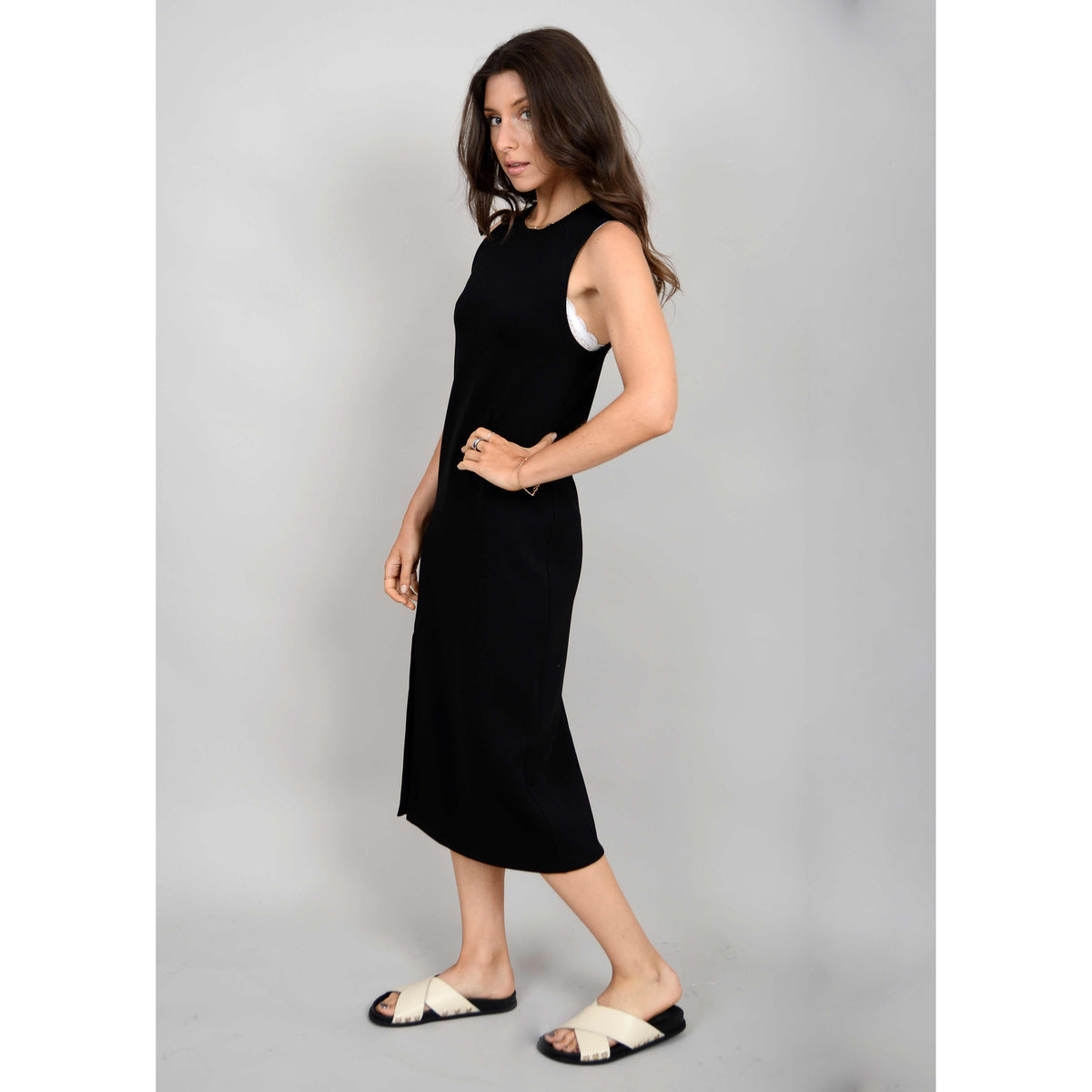 Stylishly showcase the Scuba Adina Soft Knit Sleeveless Dress, perfect for summer adventures and effortless comfort.
