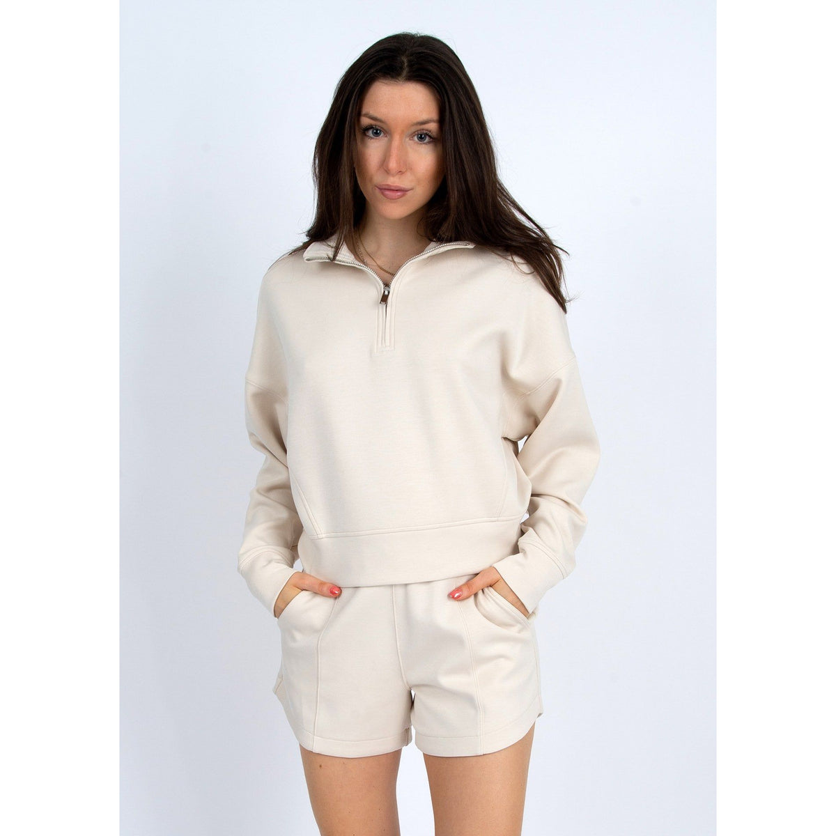 Stylish Mailyn Soft Scuba 1/2 Zip Pull Over in cream, perfect for comfort and fashion—great with matching pants.
