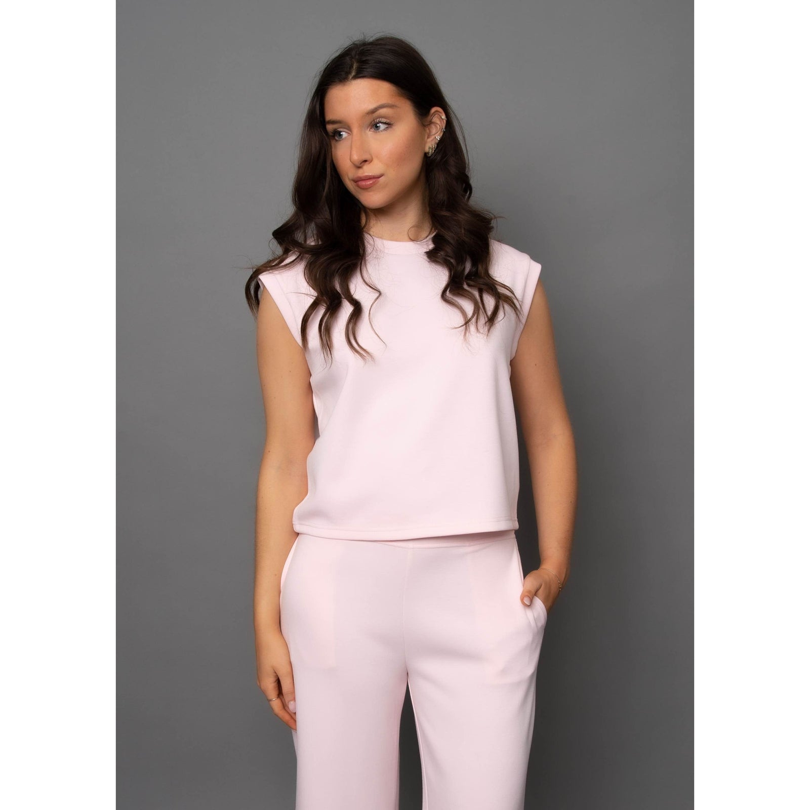 Stylish model wearing the Scuba Miva Soft Knit Tank Top, showcasing its comfort and perfect fit for any outfit.