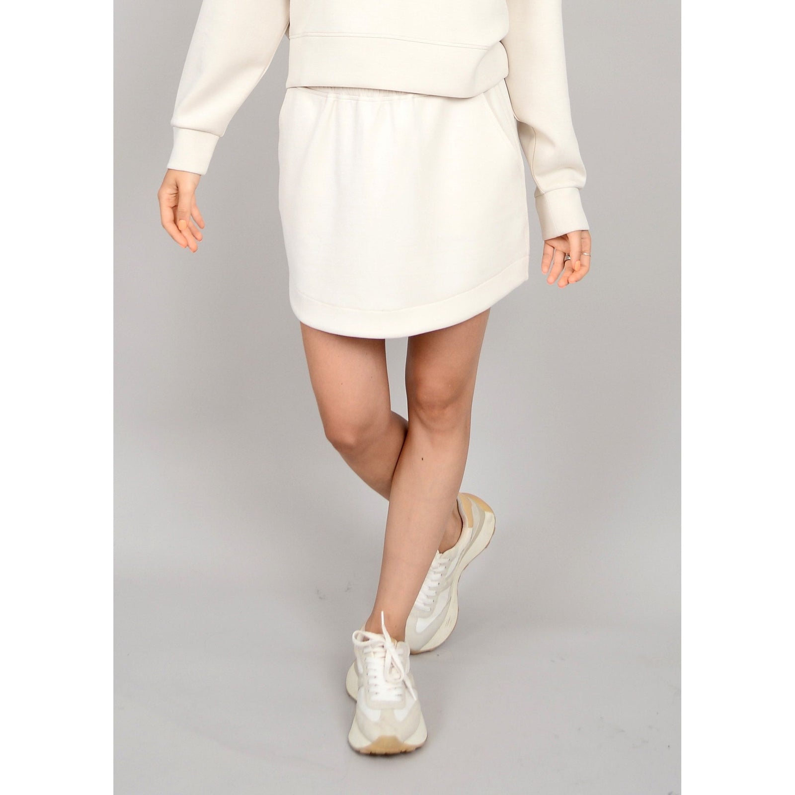 Stay stylish in the Scuba Santia Soft Knit Mini Skirt, perfect for summer days and warm nights.