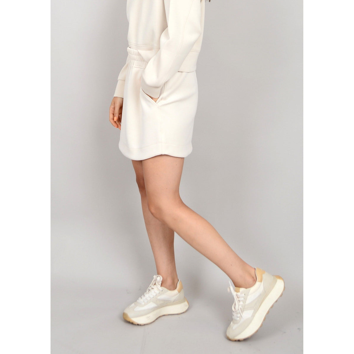 Embrace summer style with the Scuba Santia Soft Knit Mini Skirt, perfect for sunny days and warm nights.