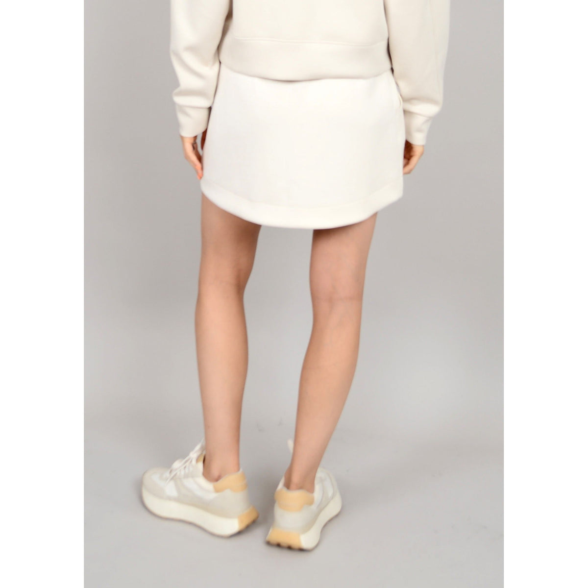 Flirty Scuba Santia Soft Knit Mini Skirt, perfect for summer days, features stretchy fabric for ultimate comfort.