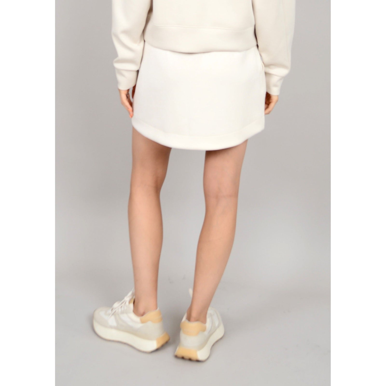 Flirty Scuba Santia Soft Knit Mini Skirt, perfect for summer days, features stretchy fabric for ultimate comfort.