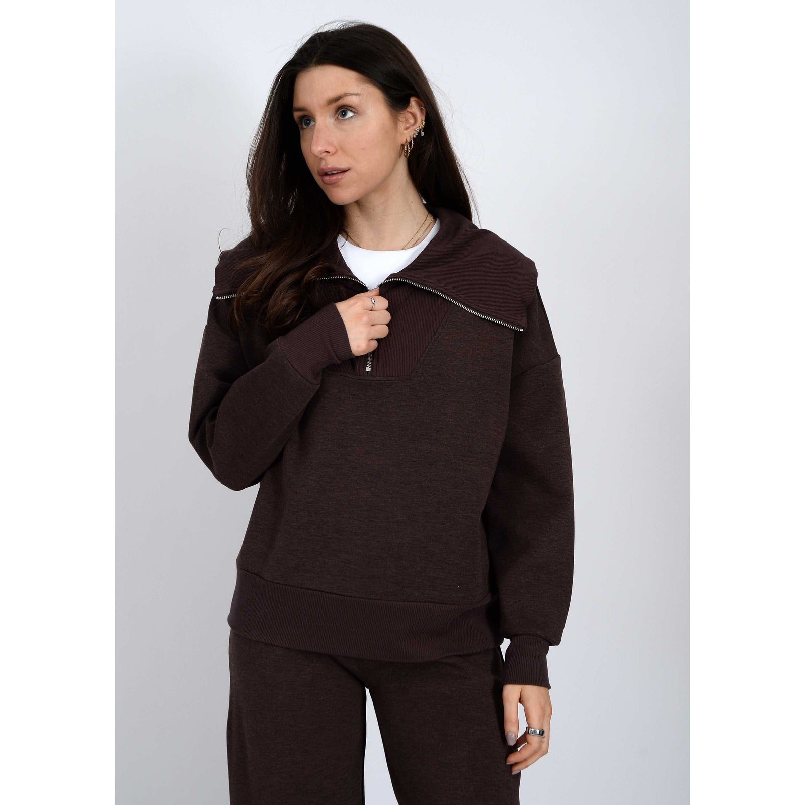 Model in dark brown soft-knit half-zip pullover from Scuba Sean; Prida Soft Knit Pull-On Drawstring Pant styling.