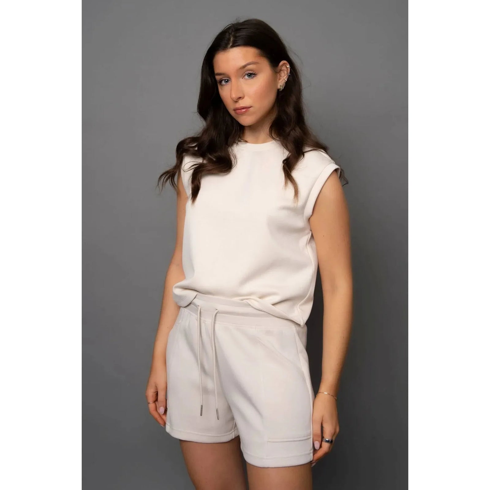 Scuba Senza Soft Knit Shorts on model Sharlen (5 ft 6), pink lounge shorts with pockets and a matching top option