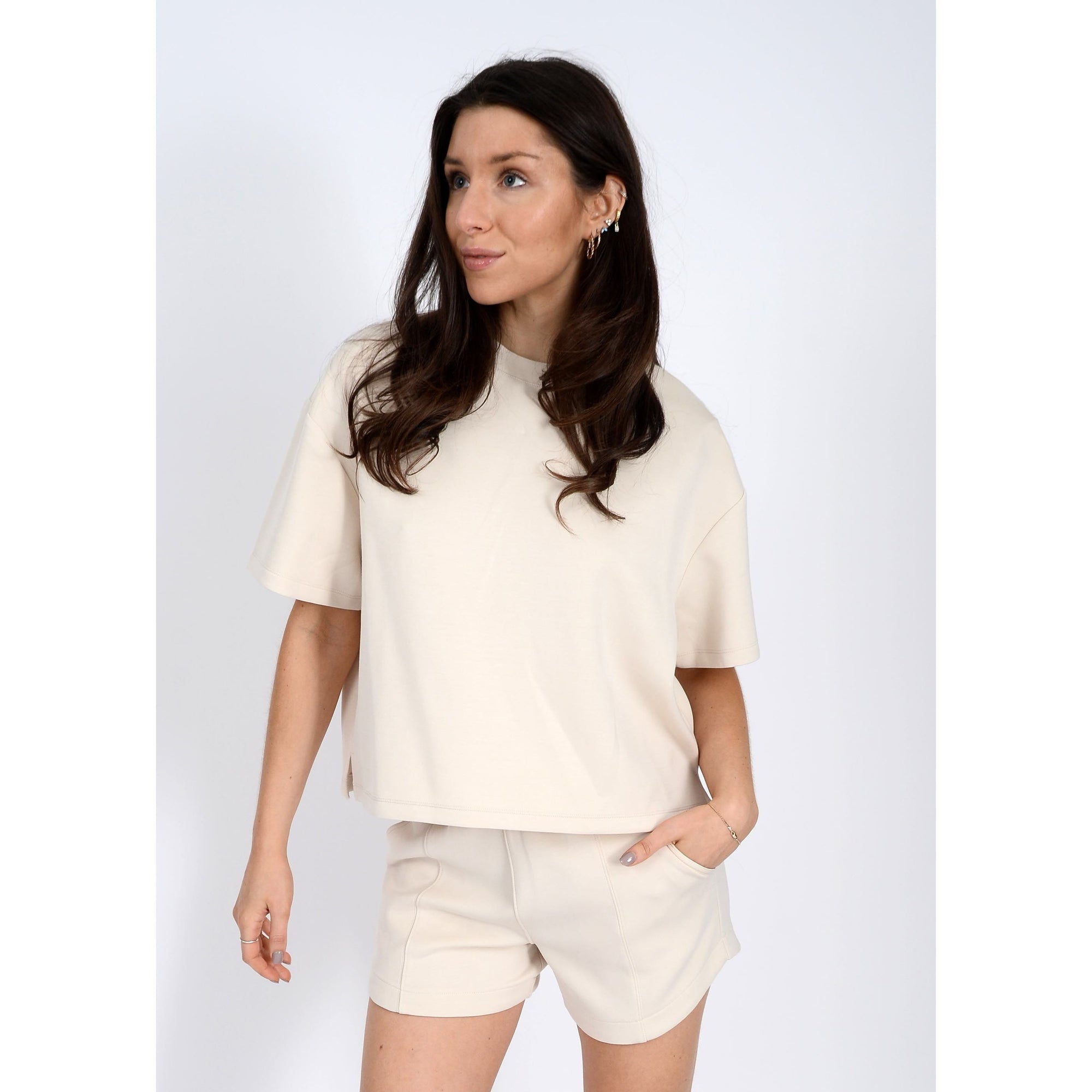 Stylish Scuba Tess Soft Knit Top in cream, perfect for casual outfits and ultra-comfortable wear. Pairs well with denim.