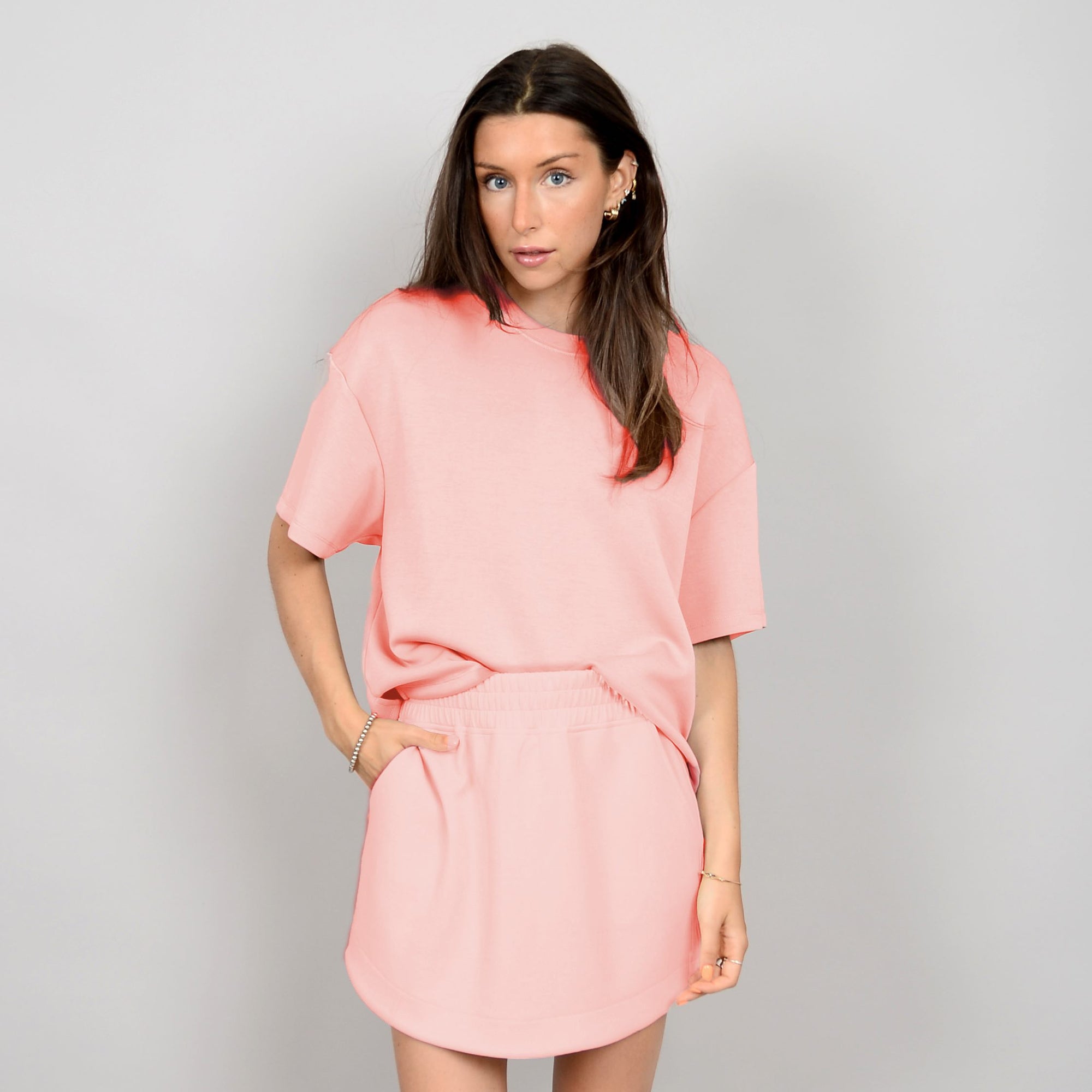 Soft and stylish, the Scuba Tess Soft Knit Top in dusty peach offers ultimate comfort and versatility for any outfit.