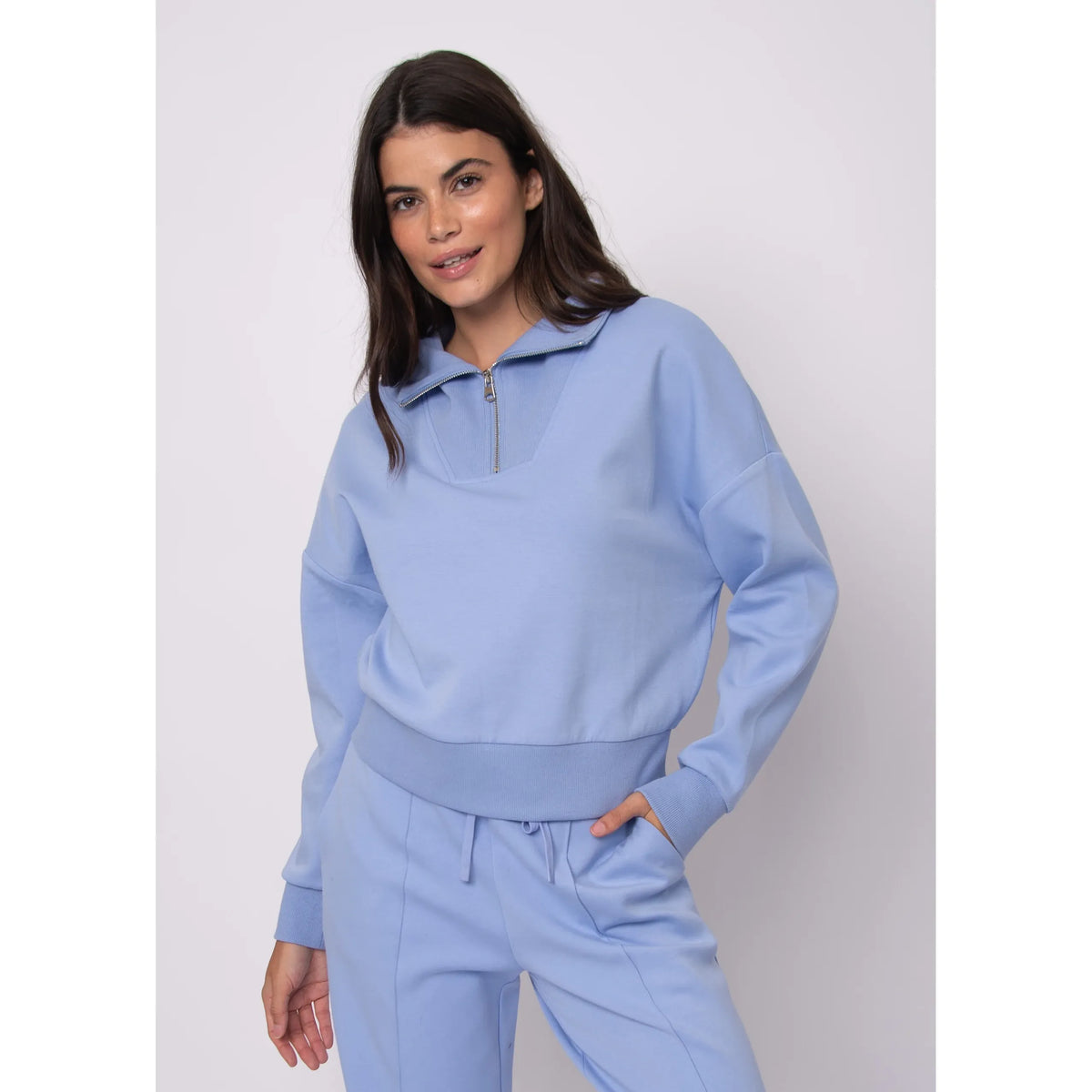Seanni Soft Knit Half Zip Pullover in light blue worn by a model; half-zip collar, cozy fall knit.