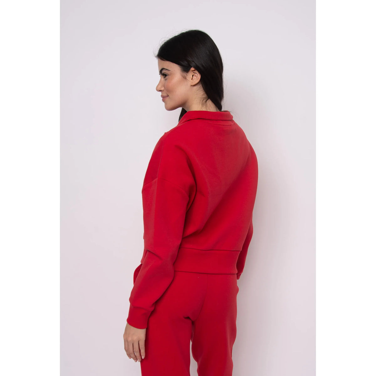 Seanni Soft Knit Half Zip Pullover worn by a model in red, side view showing cozy fall knit and relaxed fit.