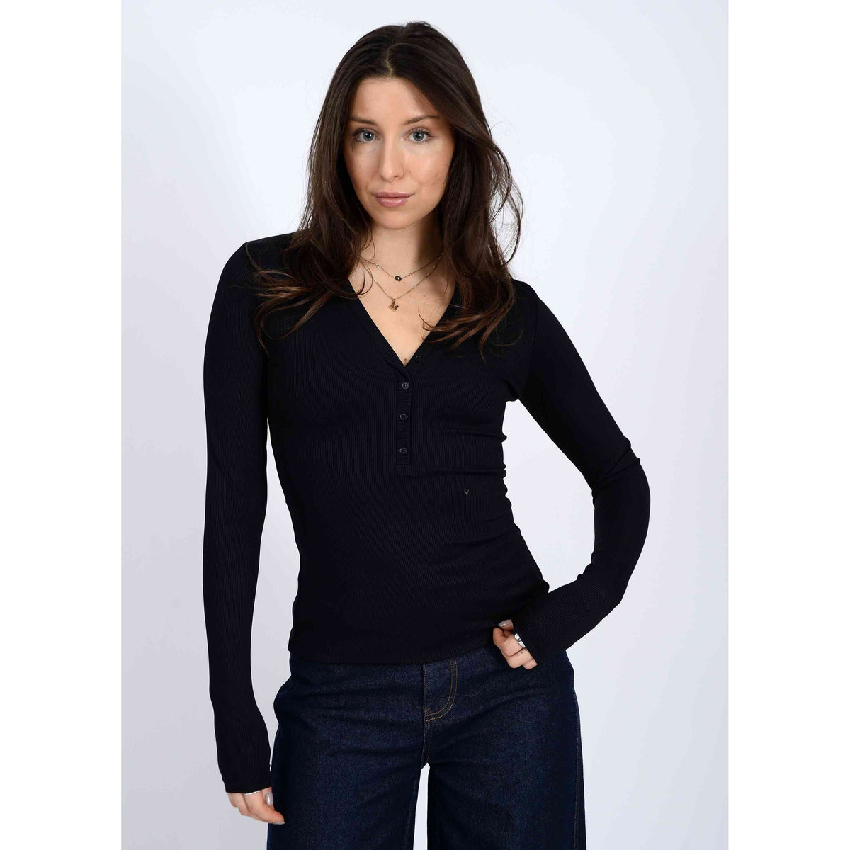 Second Skin Helane 23 2x2 Rib Henley black rib knit long-sleeve top on model, flattering silhouette.