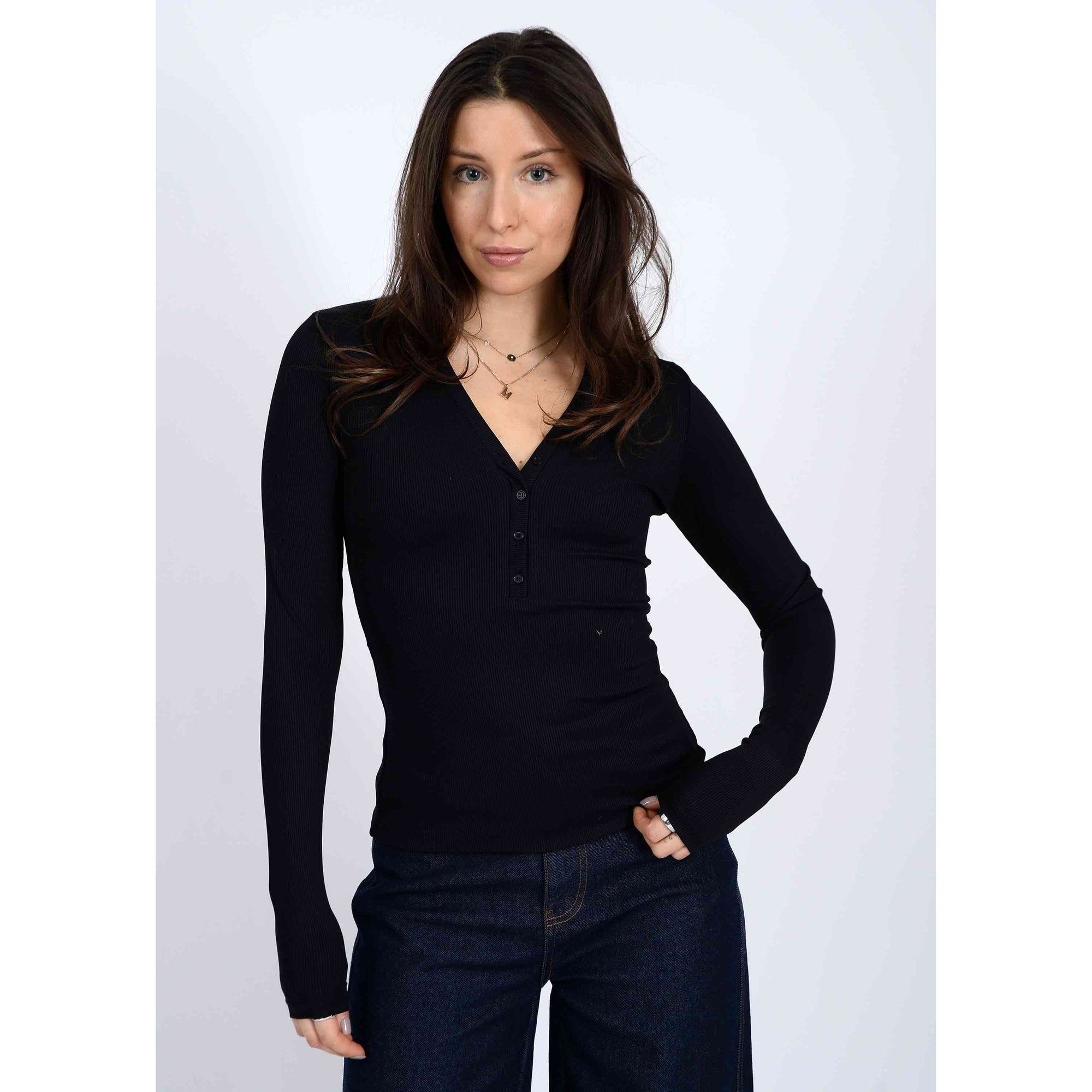 Second Skin Helane 23 2x2 Rib Henley black rib knit long-sleeve top on model, flattering silhouette.