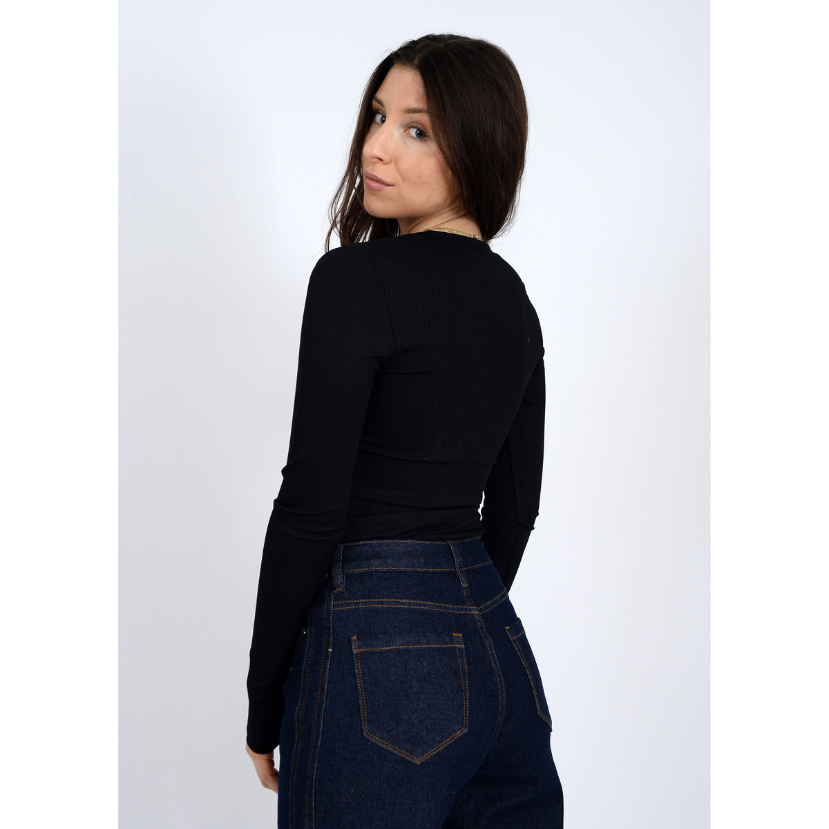 Second Skin Helane 23 2x2 Rib Henley worn by model in black ribbed long-sleeve top.