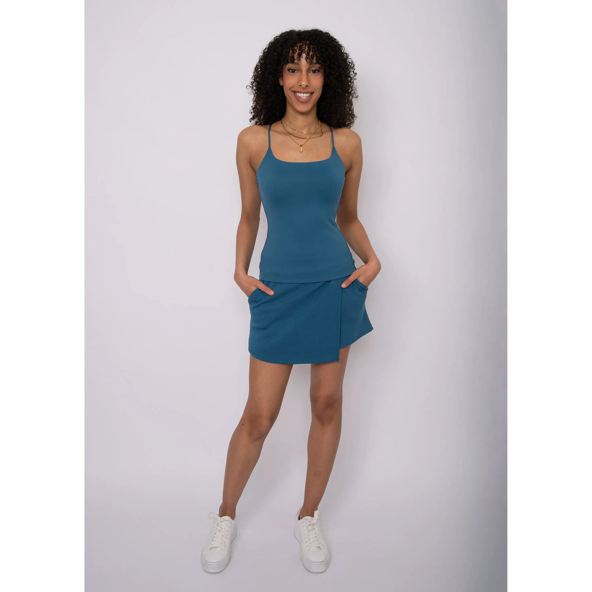 Teal Perla Cami Tank on a model: relaxed-fit camisole with thin straps, subtle sheen polyester fabric.