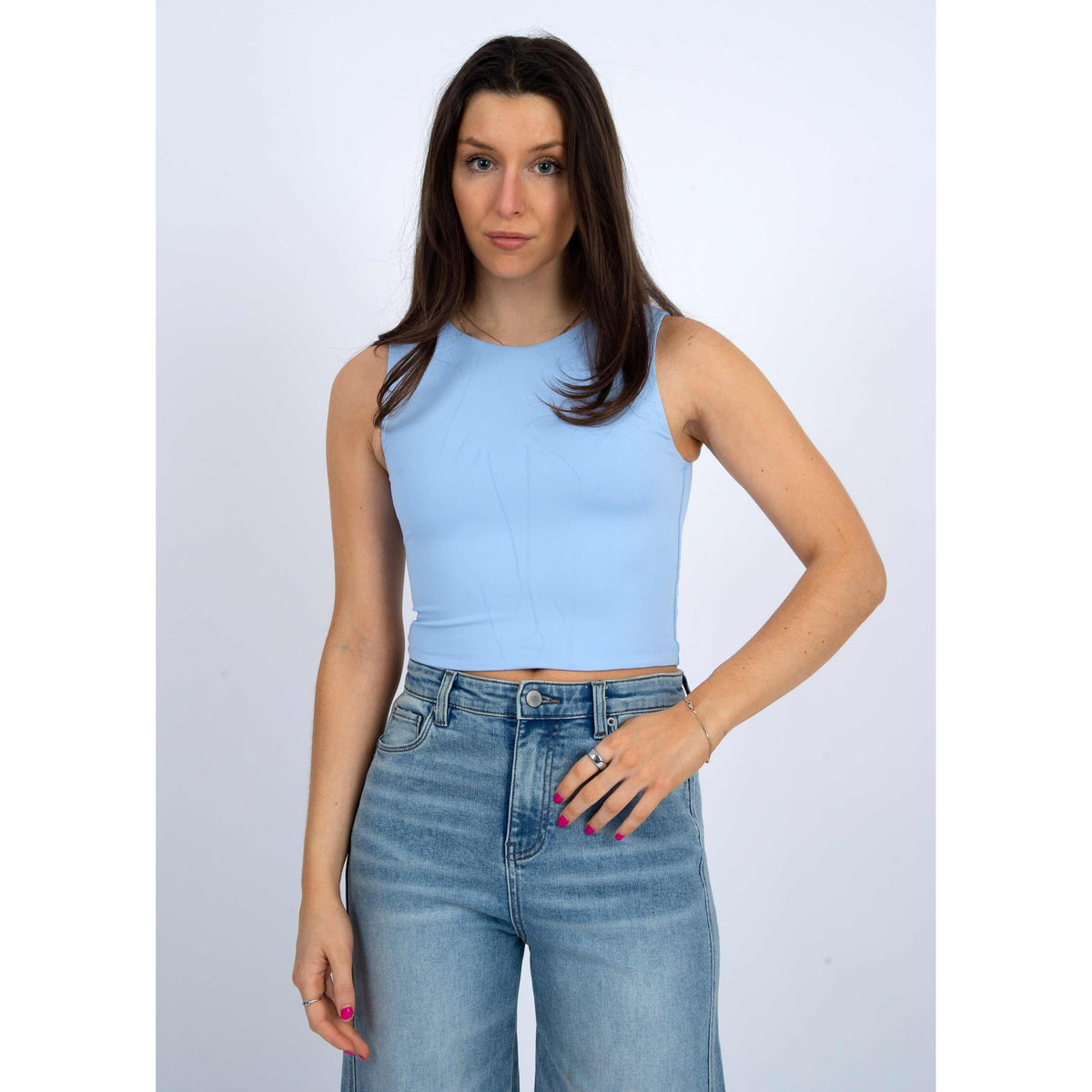 Stylish model wearing the Second Skin Roxanna Crew Neck Tank Top by RD Style in light blue, perfect for casual wear.