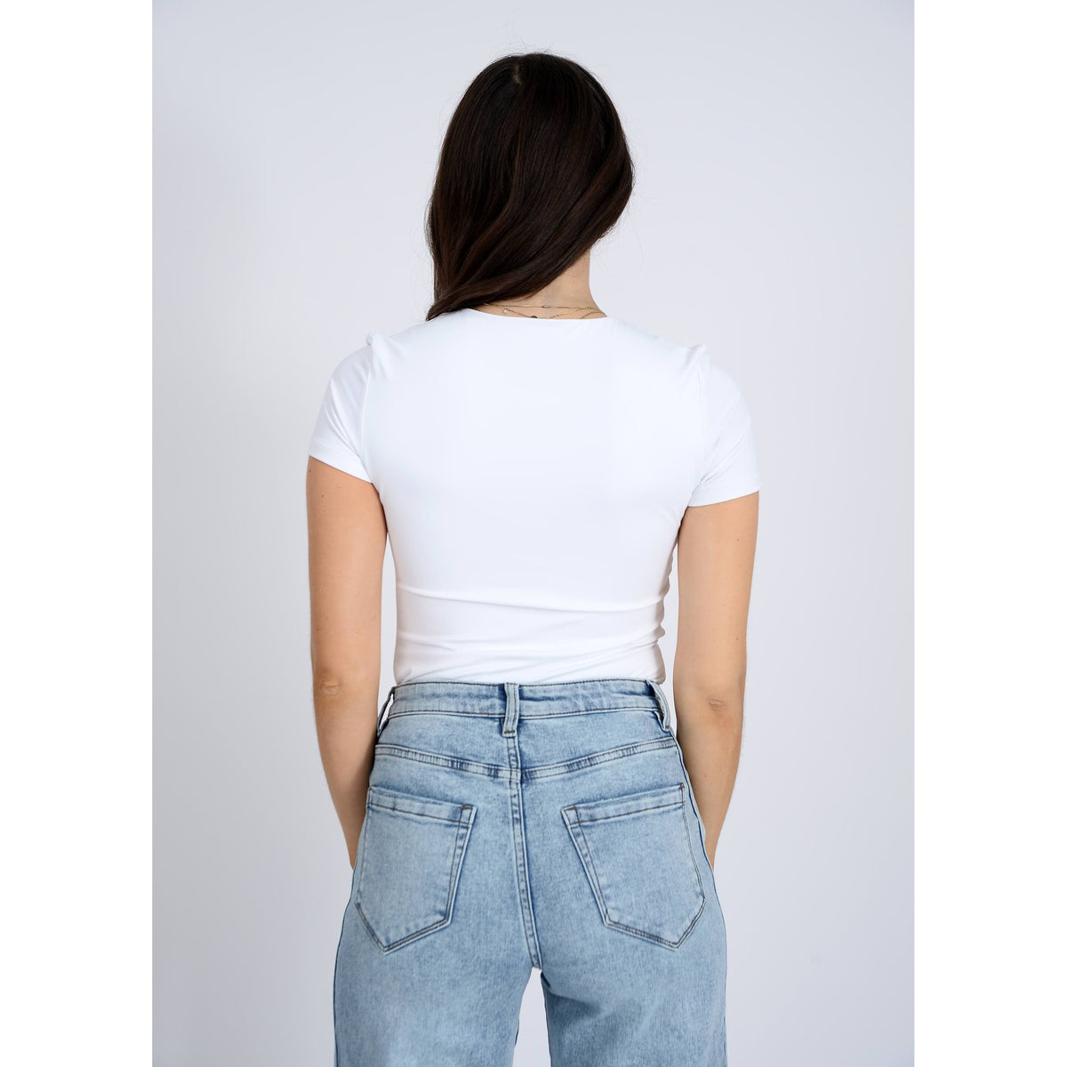 Second Skin Roxi 23 Crewneck TShirt by RD Style on model in white high-crewneck tee.