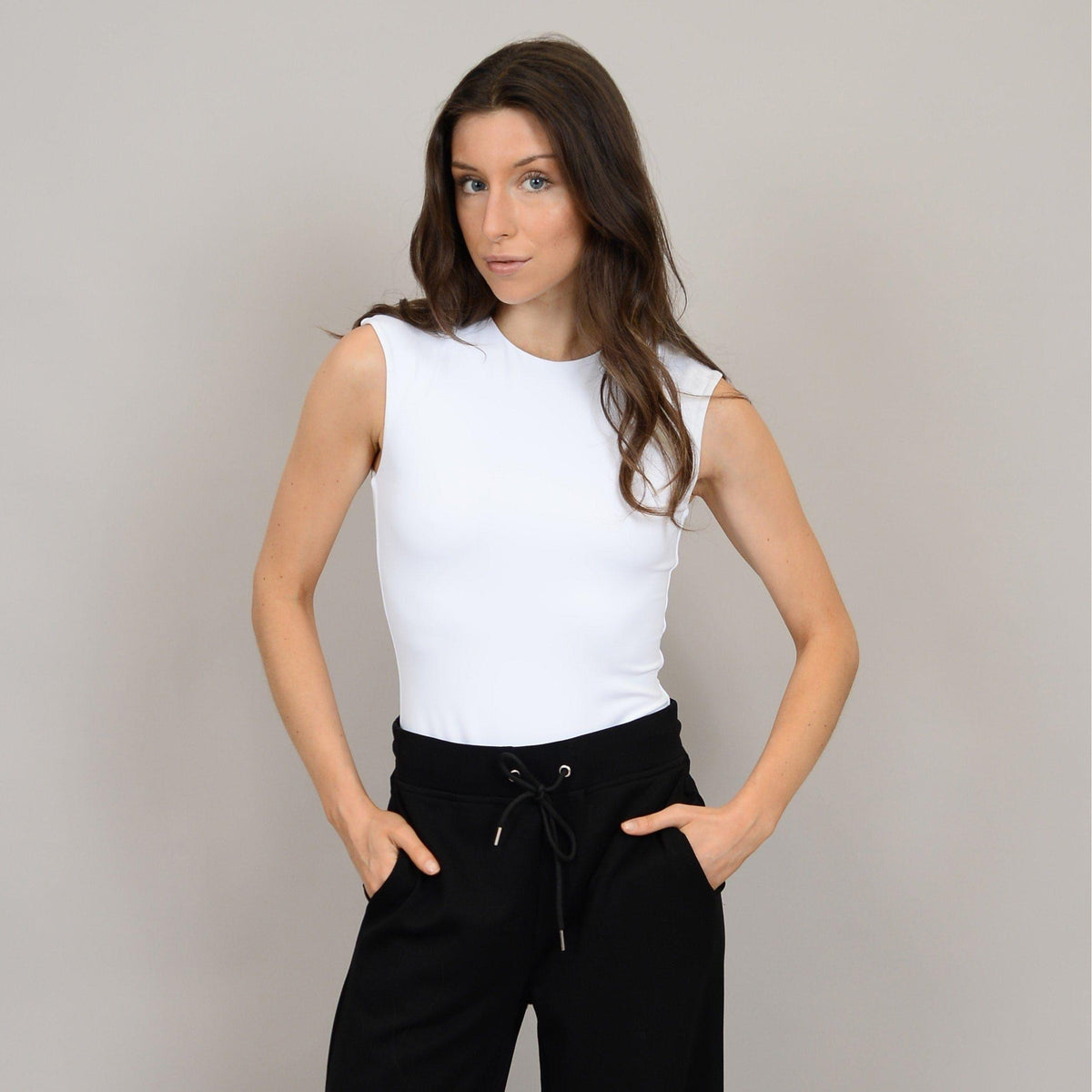Stylish model showcases the Second Skin Roxi Crew Sleeveless Bodysuit by RD Style, perfect for everyday wear.
