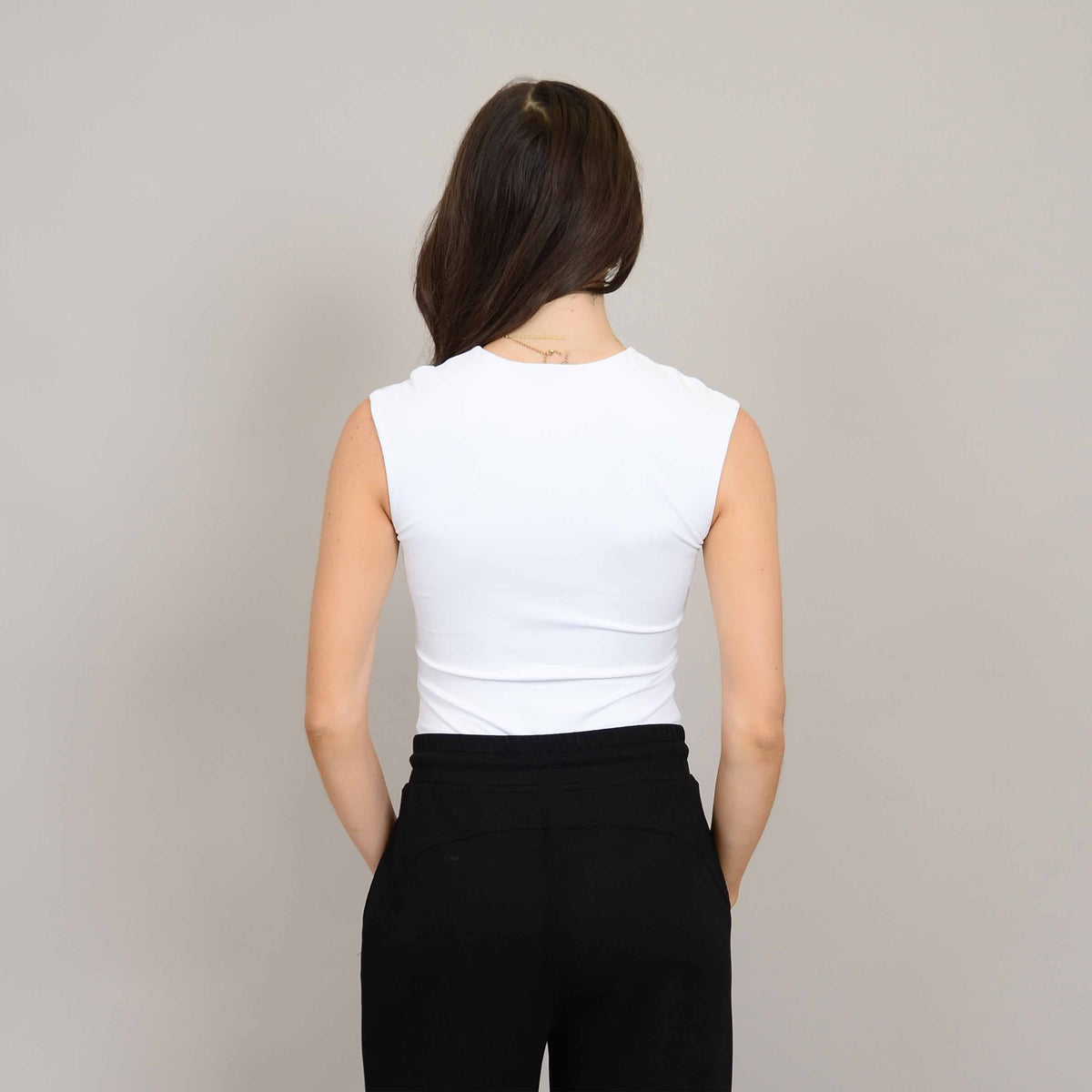 The Second Skin Roxi Crew Sleeveless Bodysuit by RD Style offers a sleek, structured fit perfect for everyday wear.