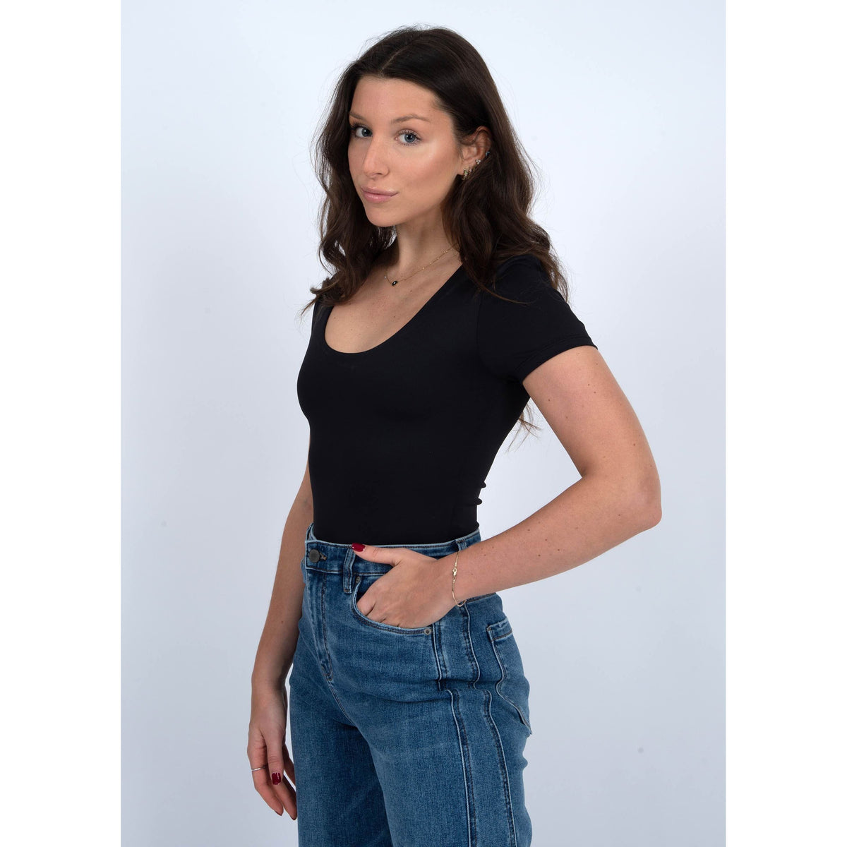 Stylish model wearing the Second Skin Sue Scoop Cap Sleeve Body Suit by RD Style, perfect for any occasion.