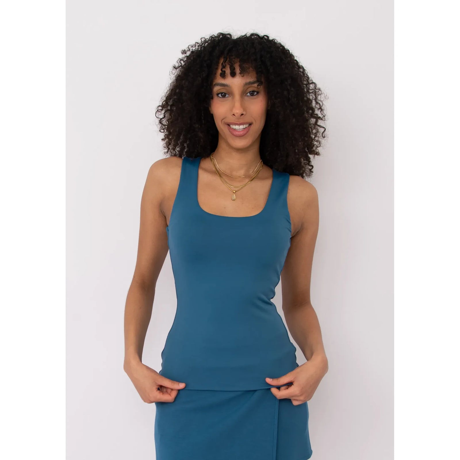 Model wearing Second Skin Tanith Double Uneck Tank Top in teal, front view