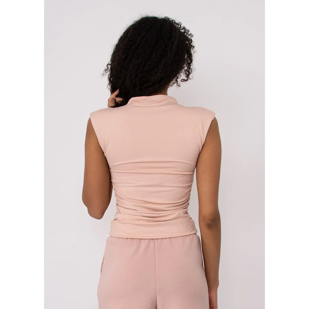 Back view of blush pink Second Skin Yve Ruched Mock Neck Tank with ruched sides.