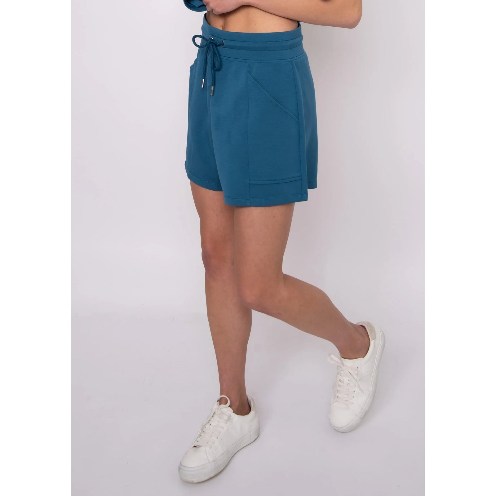 Senza Soft Knit Shorts in teal with drawstring and pockets, worn by Sharlen, 5 ft 6 in, size small.