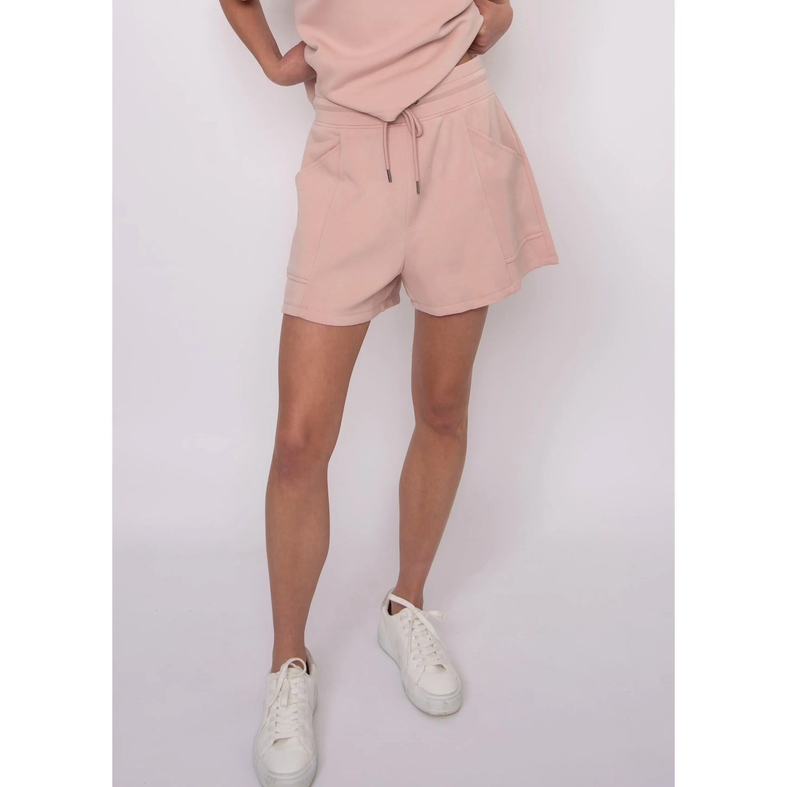 Senza Soft Knit Shorts in blush pink with drawstring waist and pockets, worn by Sharlen with a matching top.