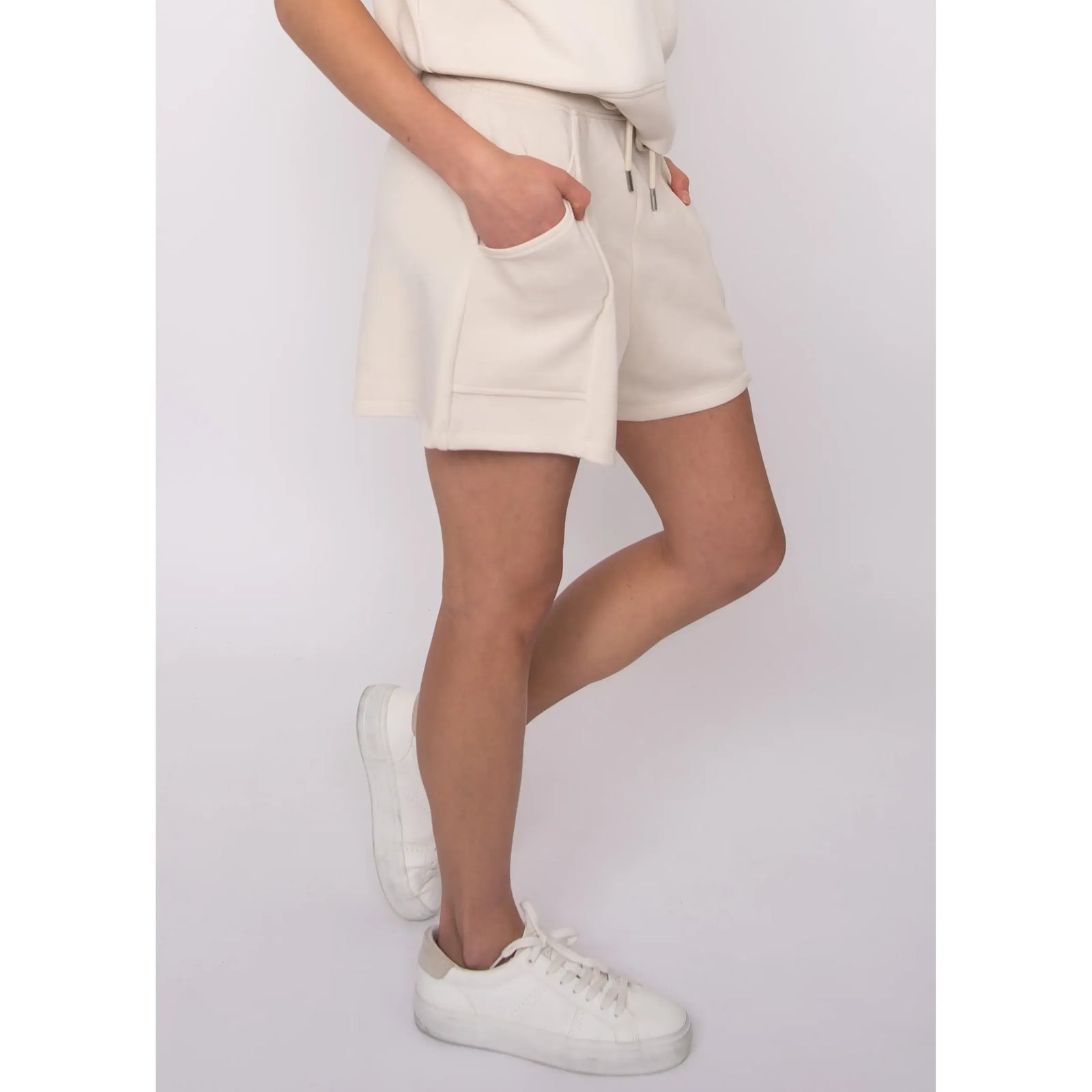 Senza Soft Knit Shorts in cream with pockets and drawstring; model Sharlen, 5'6, size small