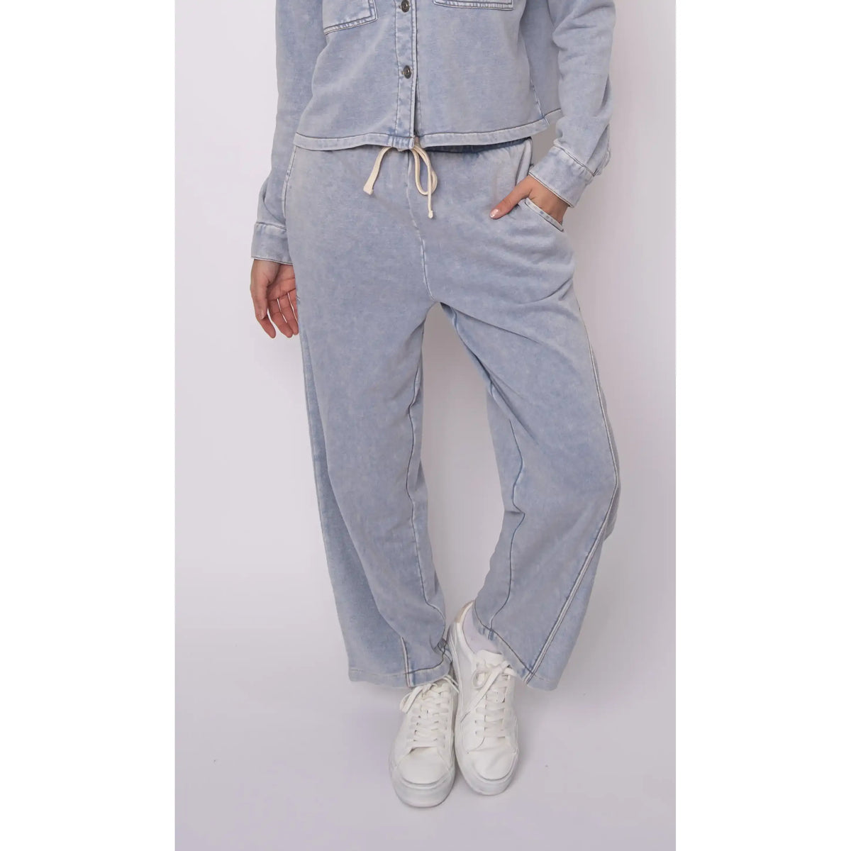 Silco French Terry pull-on drawstring pants in acid-wash light blue with a relaxed wide-leg and front pockets.