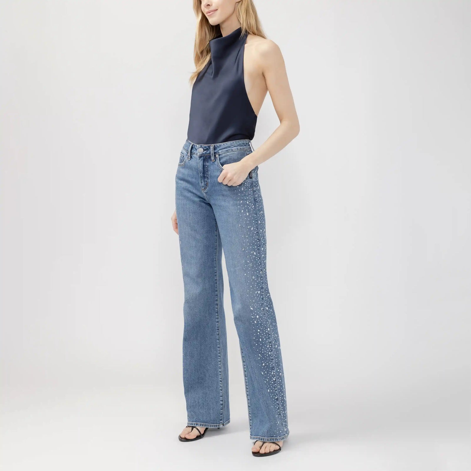 High-rise silver wildcard trousers with rhinestone detailing, featuring a curvy fit for fuller hips and a宽 leg cut.