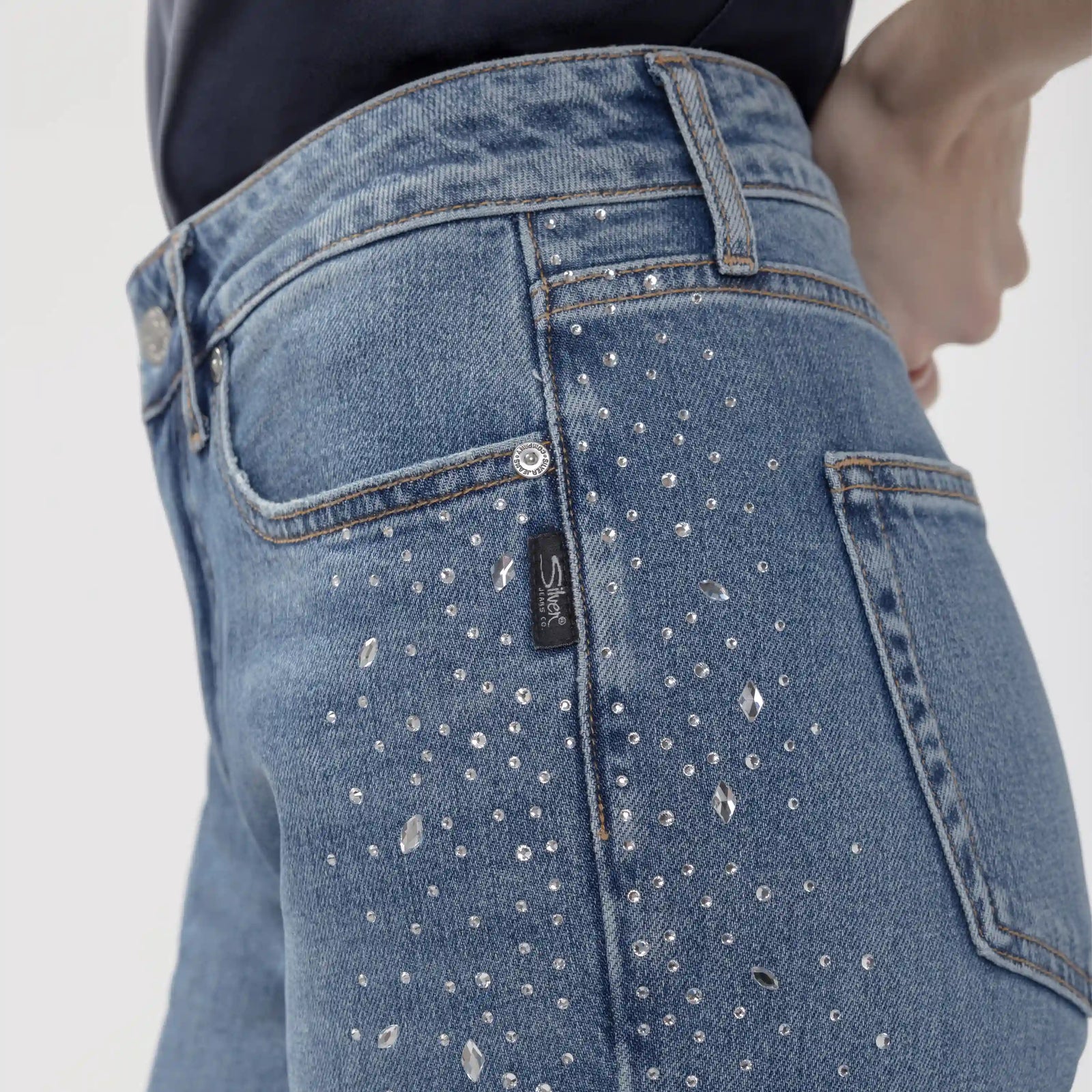 Silver Avery Wildcard trouser back pocket features scattered crystal rhinestone embellishments and a contoured high-rise waistband.
