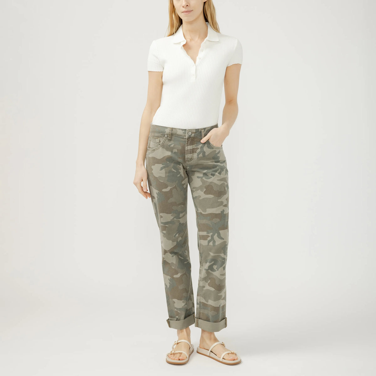Model wearing Silver Chelsea Boyfriend jeans in camo with cuffed hems and a white ribbed polo.