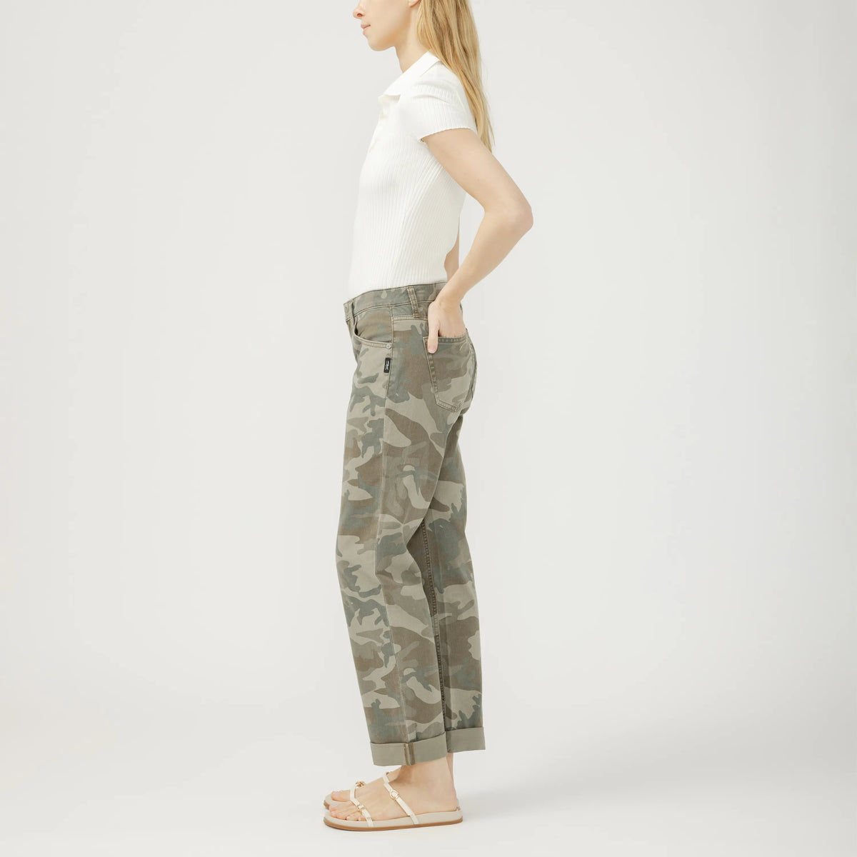 Side view of a model wearing Silver Chelsea Boyfriend in Camo jeans with mid-rise, straight leg, cuffed hem.