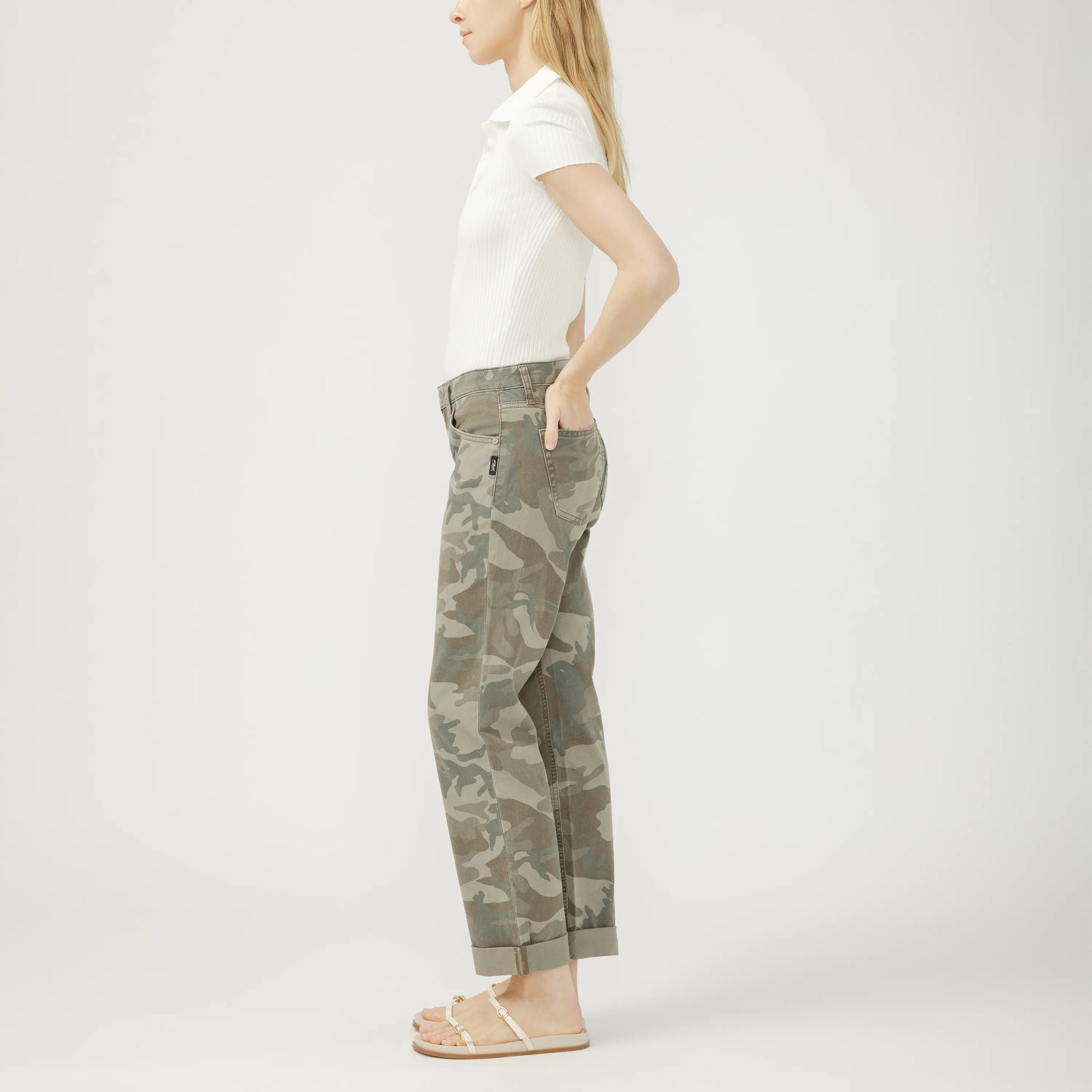 Side view of a model wearing Silver Chelsea Boyfriend in Camo jeans with mid-rise, straight leg, cuffed hem.