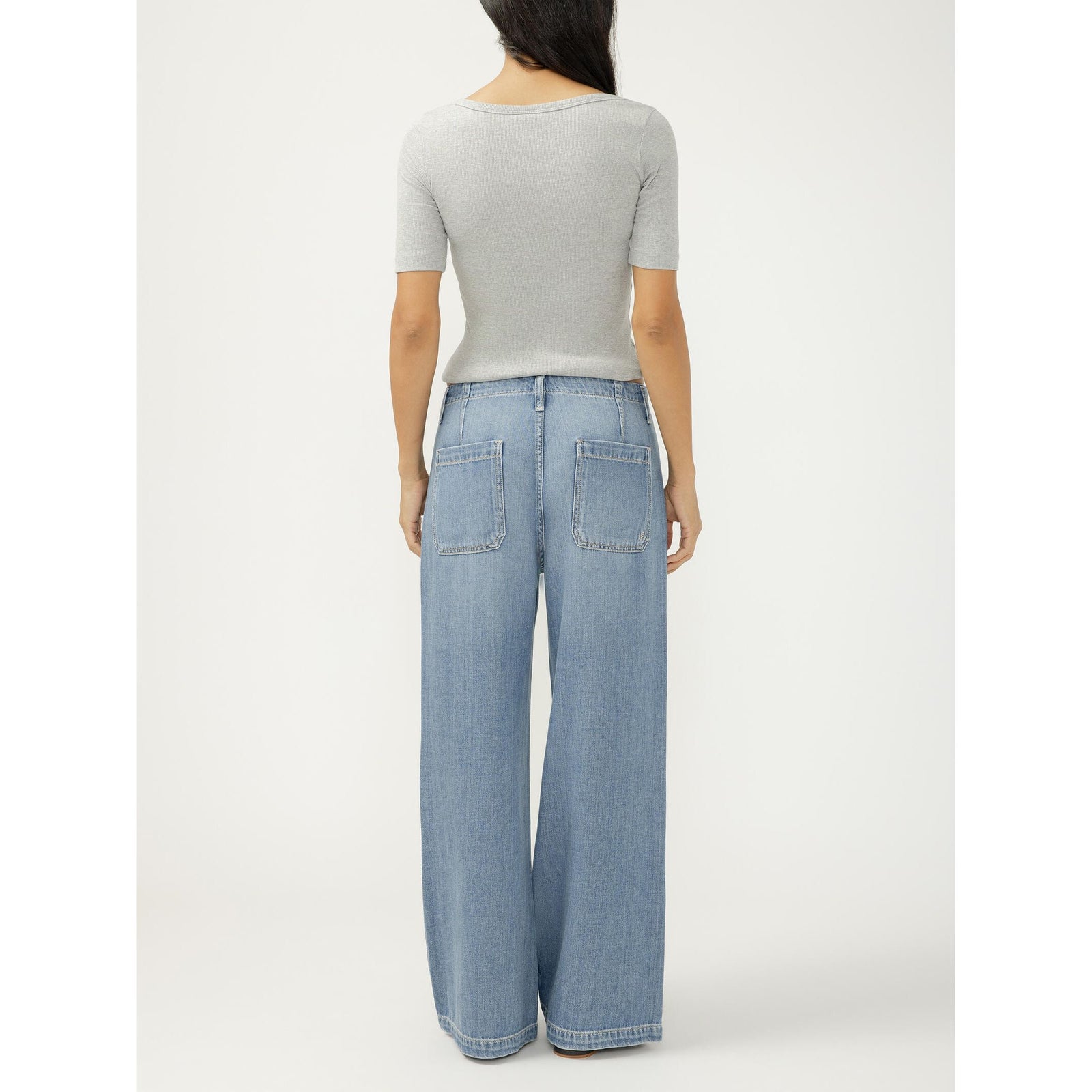 Wide-leg drawstring denim beach pants in a medium indigo wash with a relaxed fit.