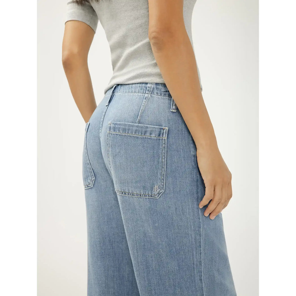 Silver Wide-Leg Drawstring Beach Pants in medium indigo denim, back view with large pockets