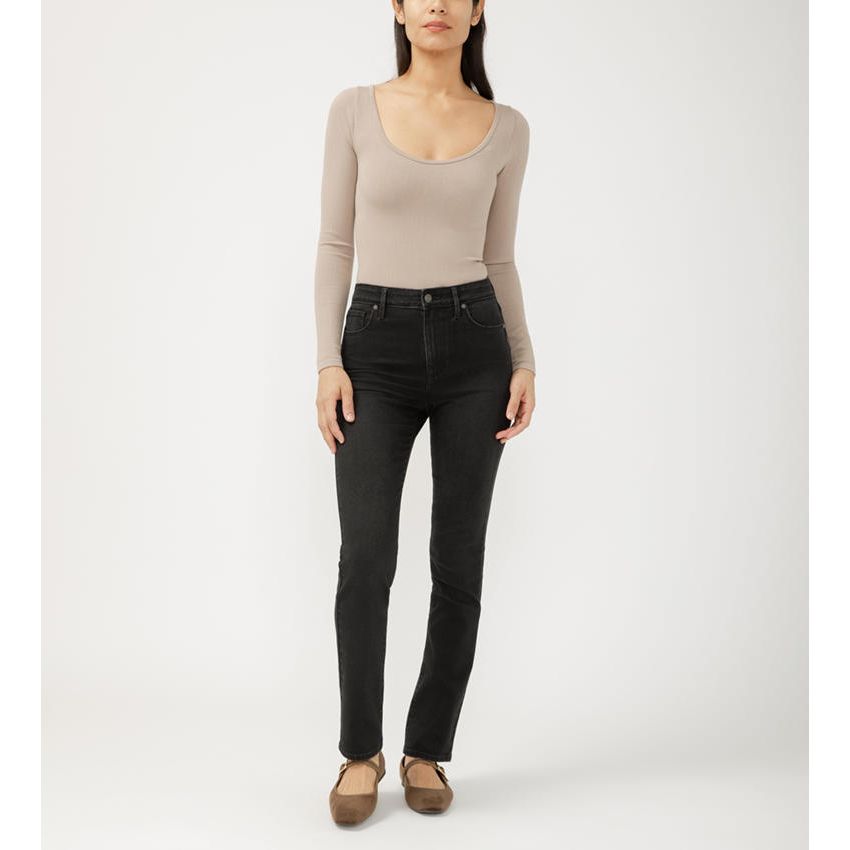 Model wearing Silver Isbister Straight in Raven denim with a taupe long-sleeve top and tan flats.