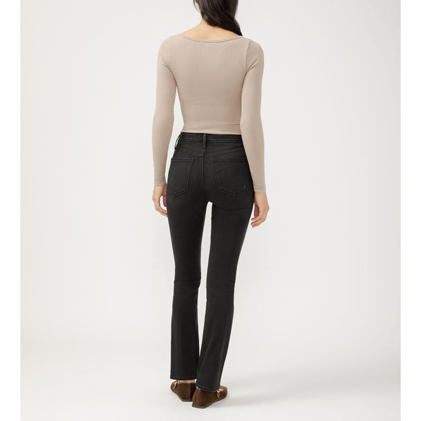 Model wearing Silver Isbister Straight in Raven denim with a taupe long-sleeve top and tan flats.