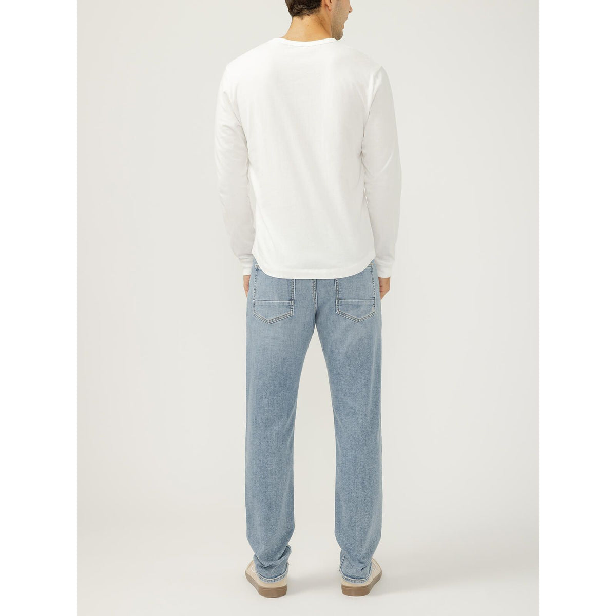 Silver Machray Slim Straight Leg in Wild outfit: back view of a model in a white long-sleeve top and light-wash jeans.