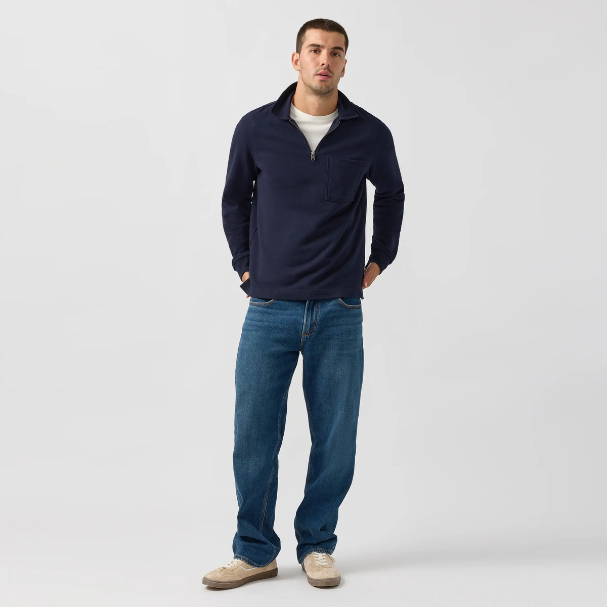 Man modeling Silver Relaxed Straight jeans in Rocky wash, a deep Y2K indigo with soft stretch and extra room through the hip and thigh.