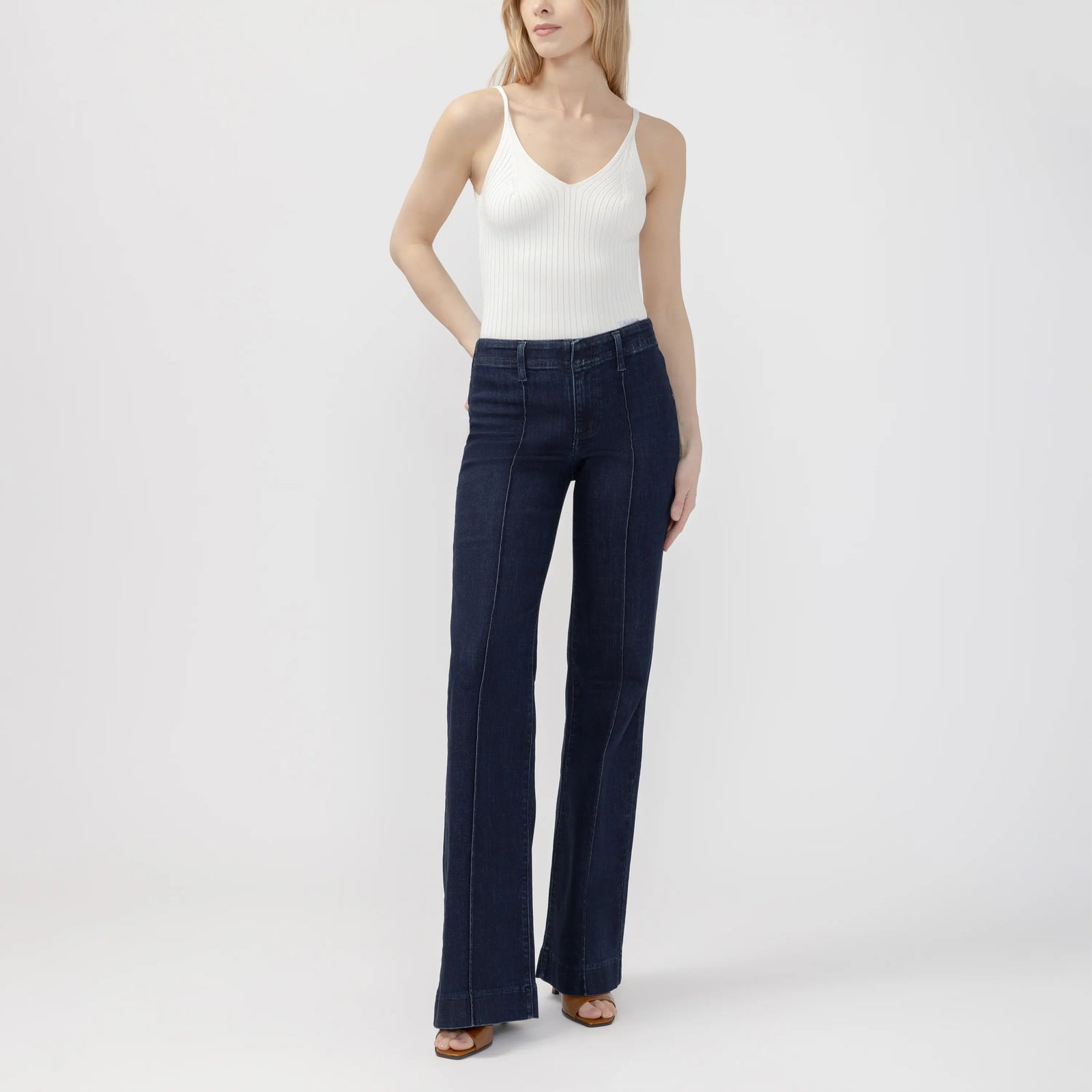 Dark wash Suki 70s trouser featuring a curvy fit, wide leg, and contoured waistband for a sleek, retro-inspired look.