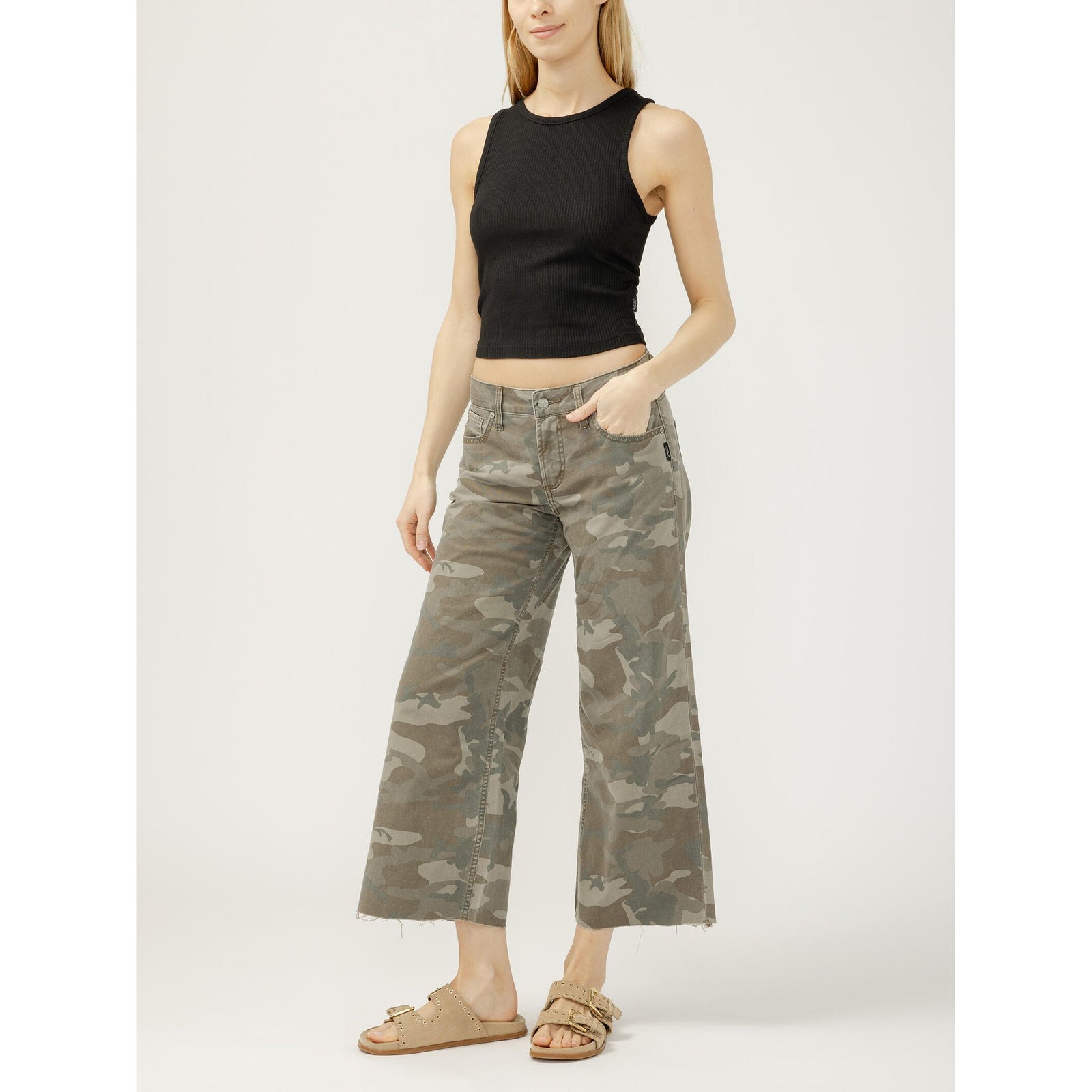 Model in black sleeveless crop top wearing Silver Suki Wide Leg Crop in Camo jeans.
