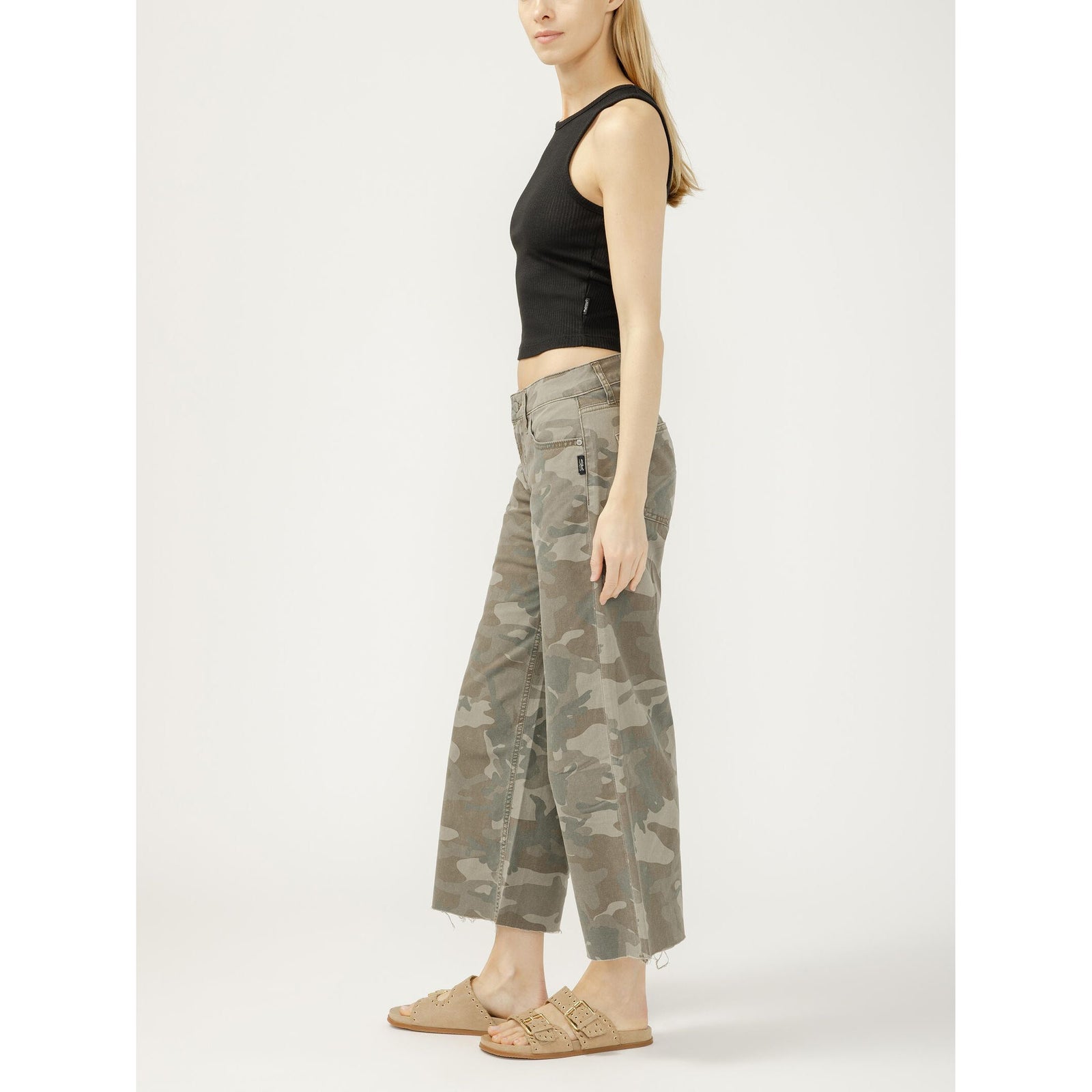 Model in black sleeveless crop top wearing Silver Suki Wide Leg Crop in Camo jeans.
