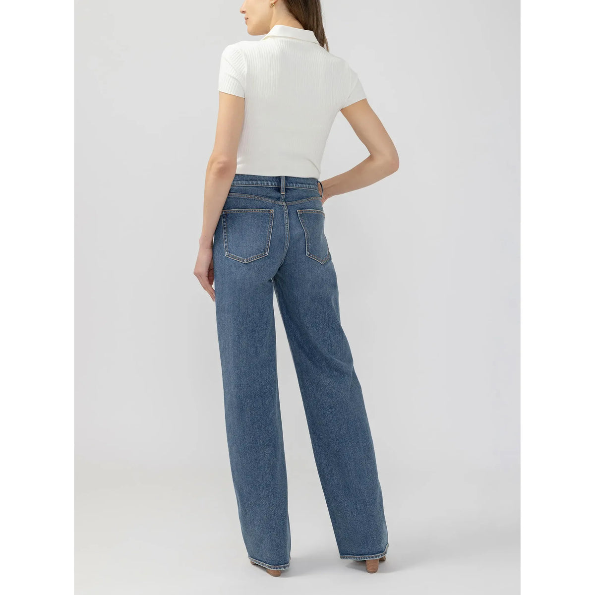 Back view of silver V front wide leg pant in root denim featuring a relaxed fit and classic pockets.