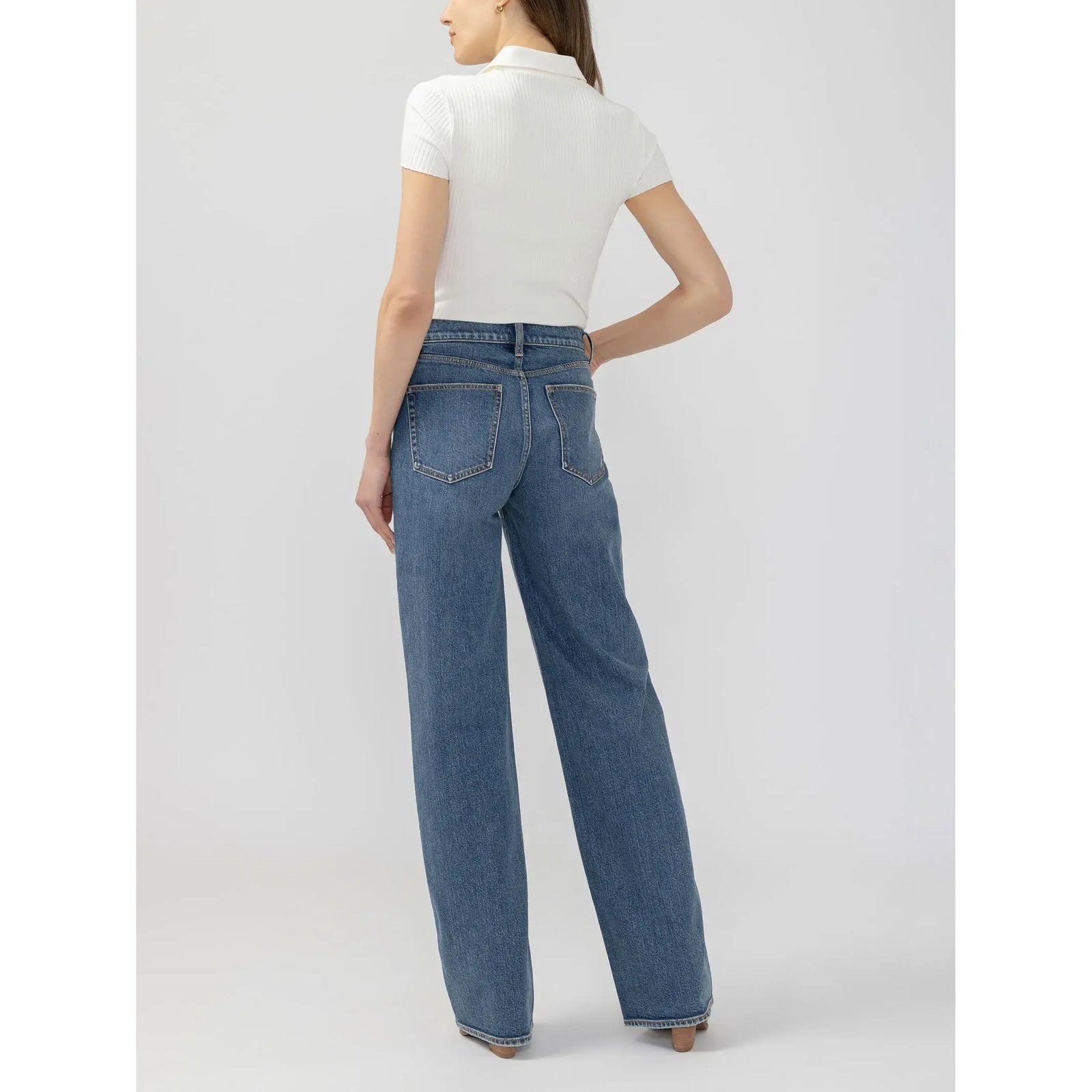 Back view of silver V front wide leg pant in root denim featuring a relaxed fit and classic pockets.