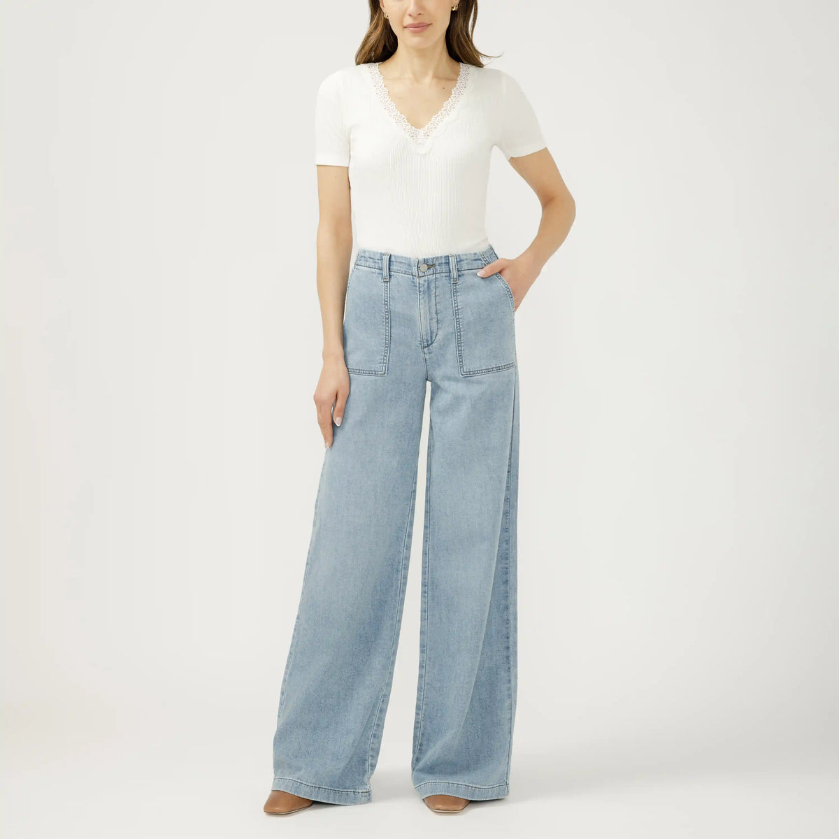 Light wash wide leg knit flex denim jeans in Crickets. Relaxed silhouette with a soft, stretchy fit that moves easily.