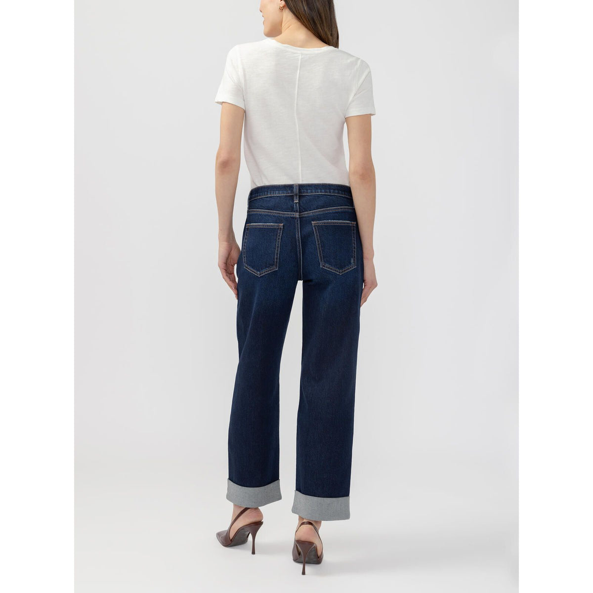 Back view of Silver Willow Relaxed Straight Leg Woolwich jeans featuring an open paperbag waist, loose fit, and wide cuffed hem in dark denim.